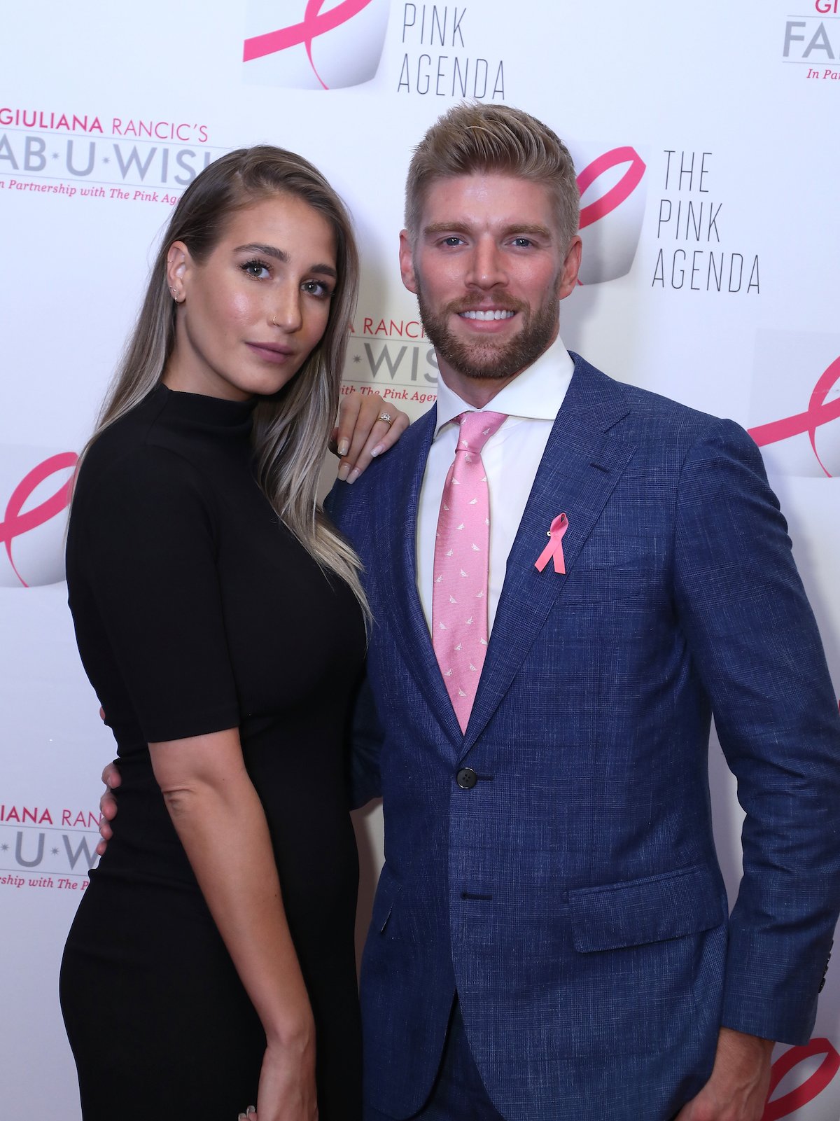 Amanda Batula and Kyle Cooke pose together at an event.