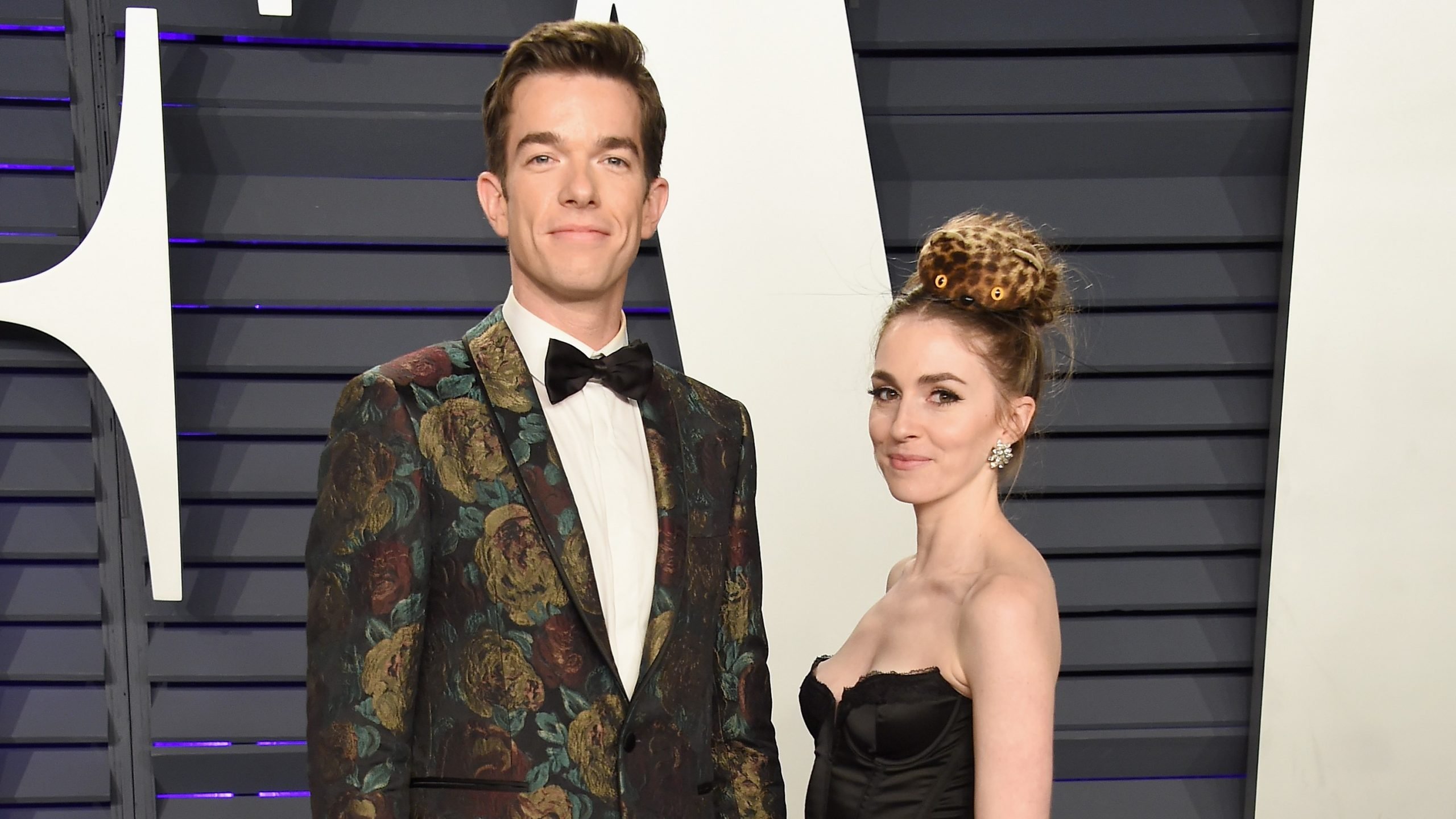John Mulaney in floral jacket and Anna Marie Tendler in black top