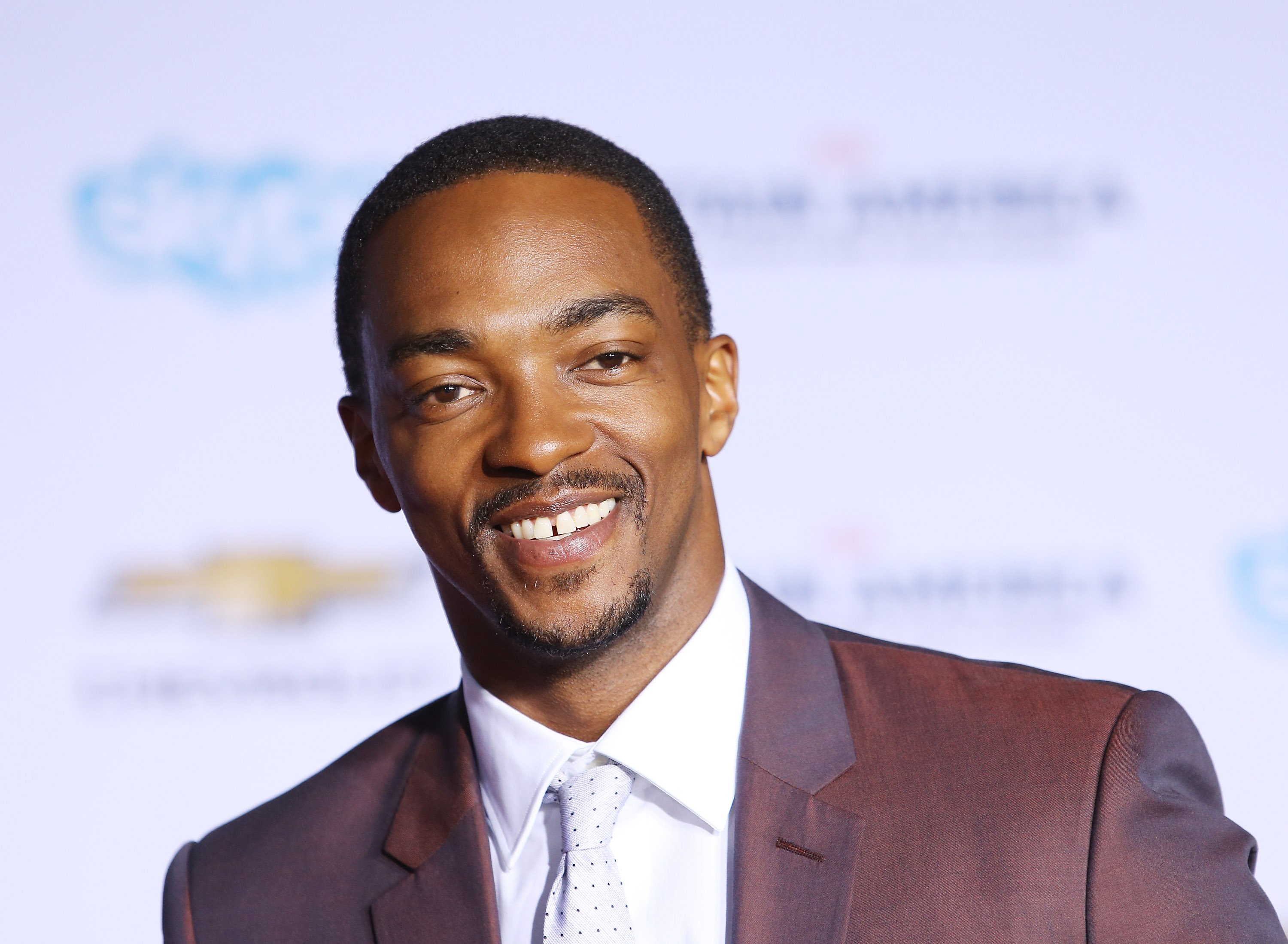 The original Falcon from Avengers, Anthony Mackie smiles at a Captain America premiere