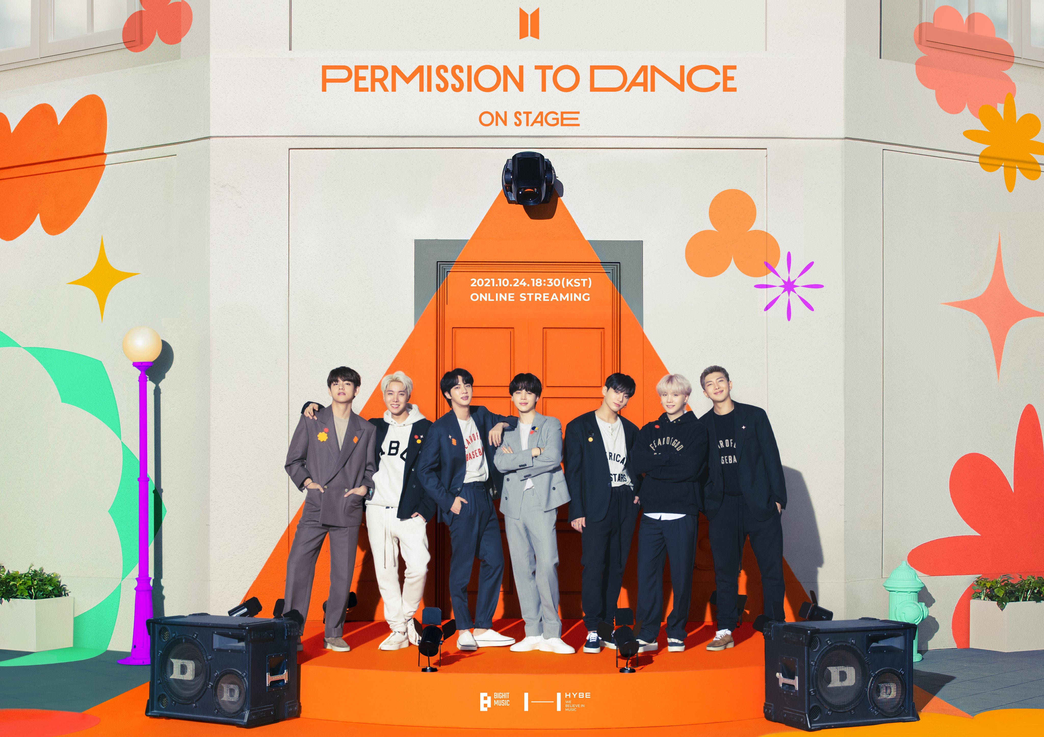 V, J-Hope, Jin, Jimin, Jungkook, Suga, and RM of BTS stand on an orange stage in front of speakers