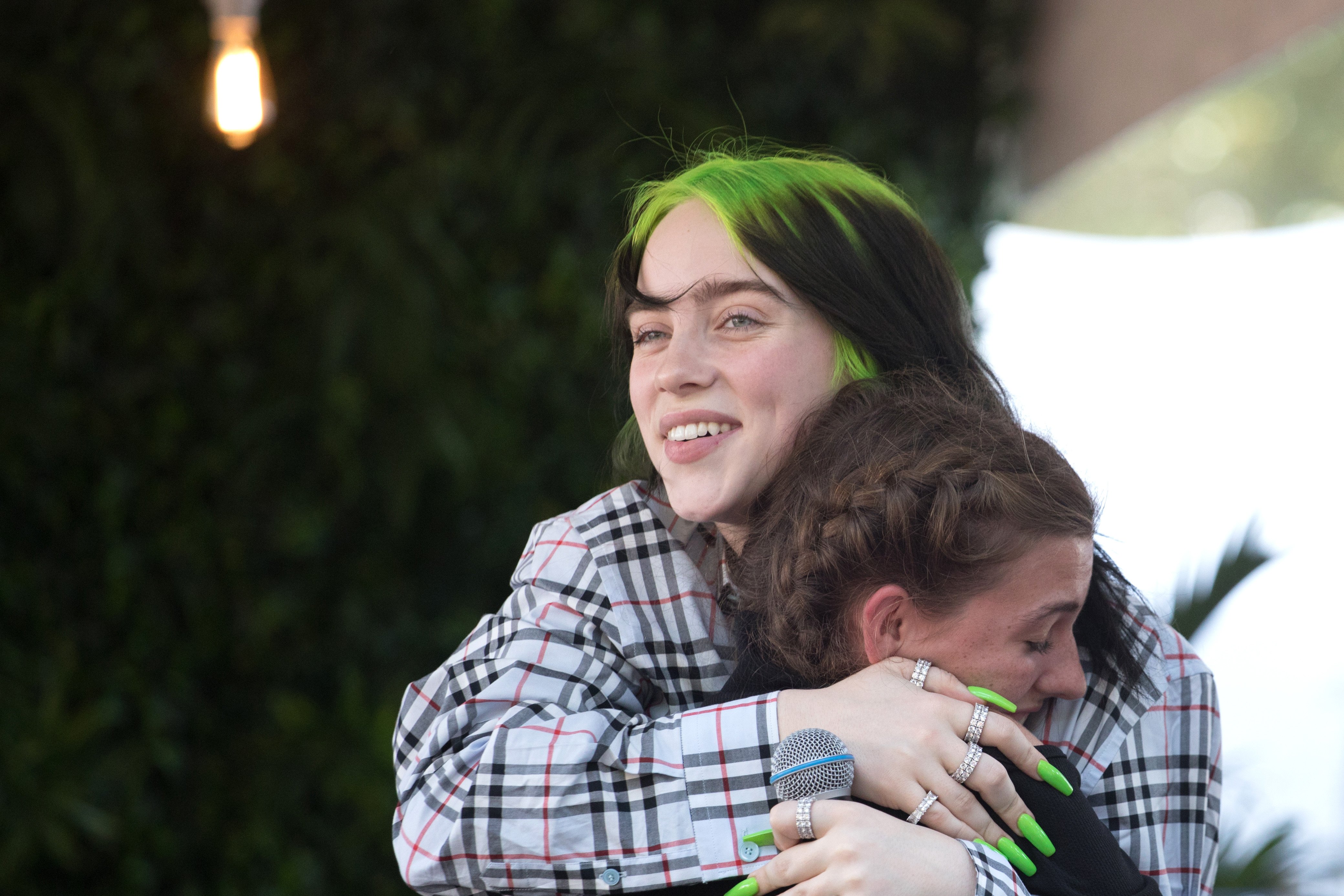 Billie Eilish hugs a fan onstage during weekend one, day two of Austin City Limits Music Festival at Zilker Park on October 04, 2019 in Austin, Texas.