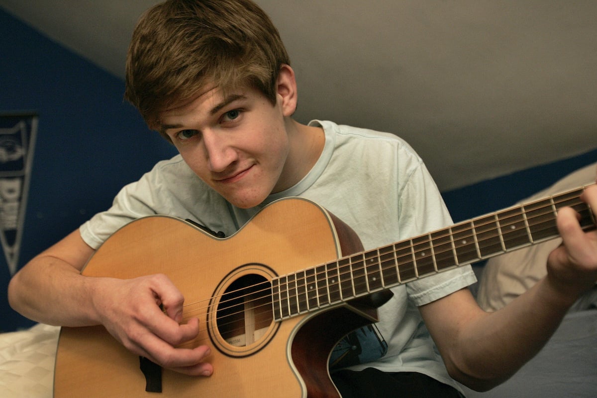 Bo Burnham is photographed in his bedroom, where he posted his YouTube video which has gotten millions of hits.