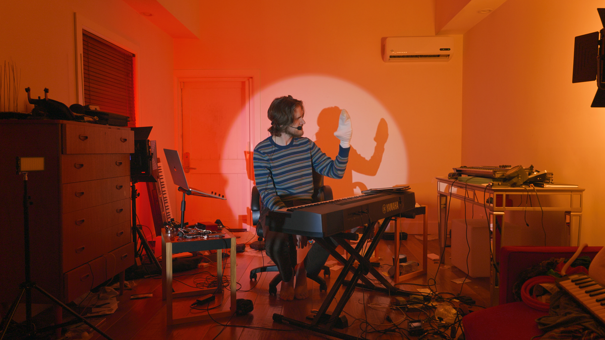 Bo Burnham sits at a piano with a sock puppet in 'Inside,' a nominee at the 2021 Emmys.