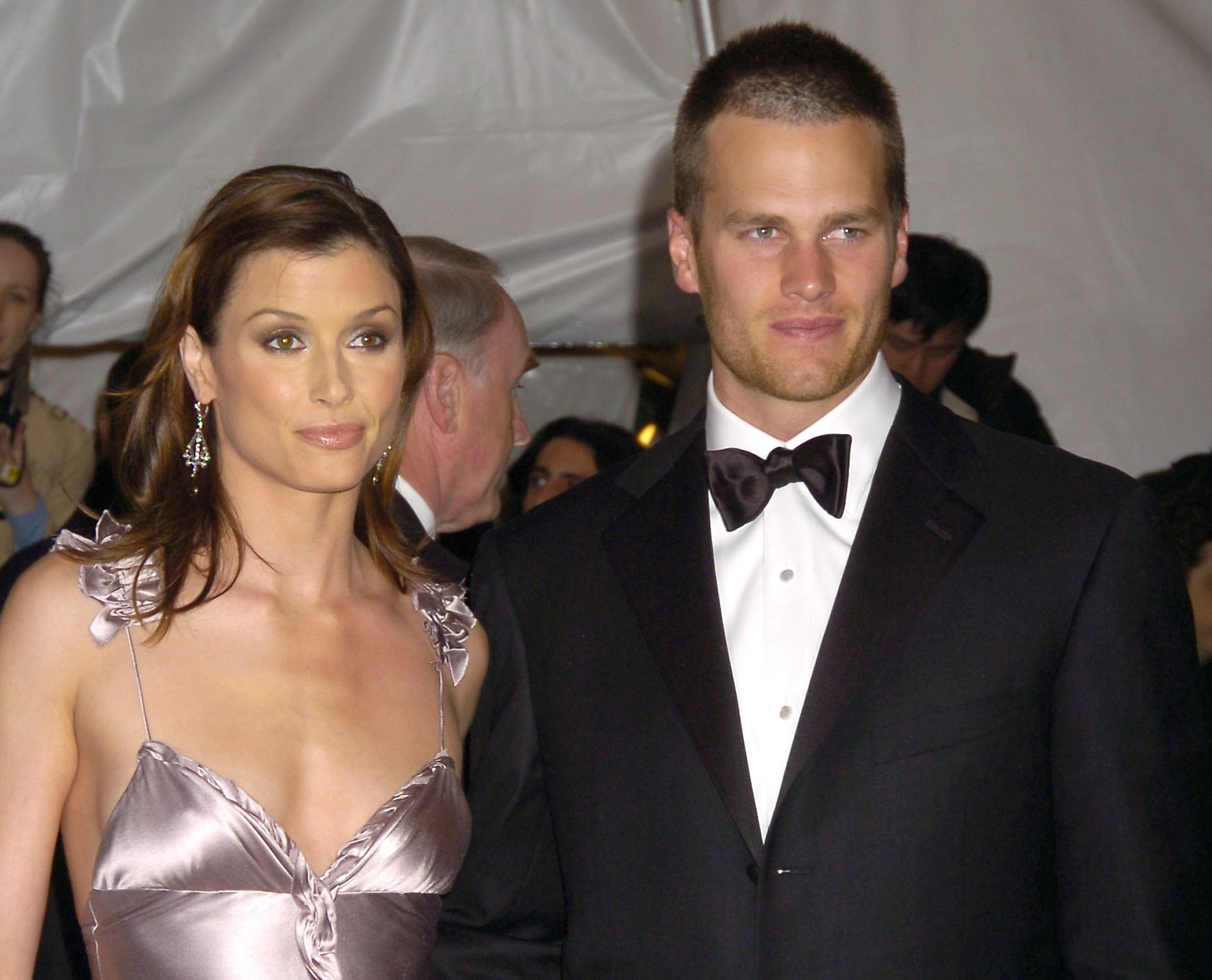 Bridget Moynahan dressed in a shimmering gown and Tom Brady in a tuxedo at The Costume Institute Gala in 2005