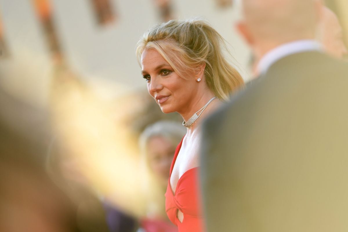 Britney Spears is in a red gown as she arrives for the premiere of Sony Pictures' "Once Upon a Time... in Hollywood" in 2019.