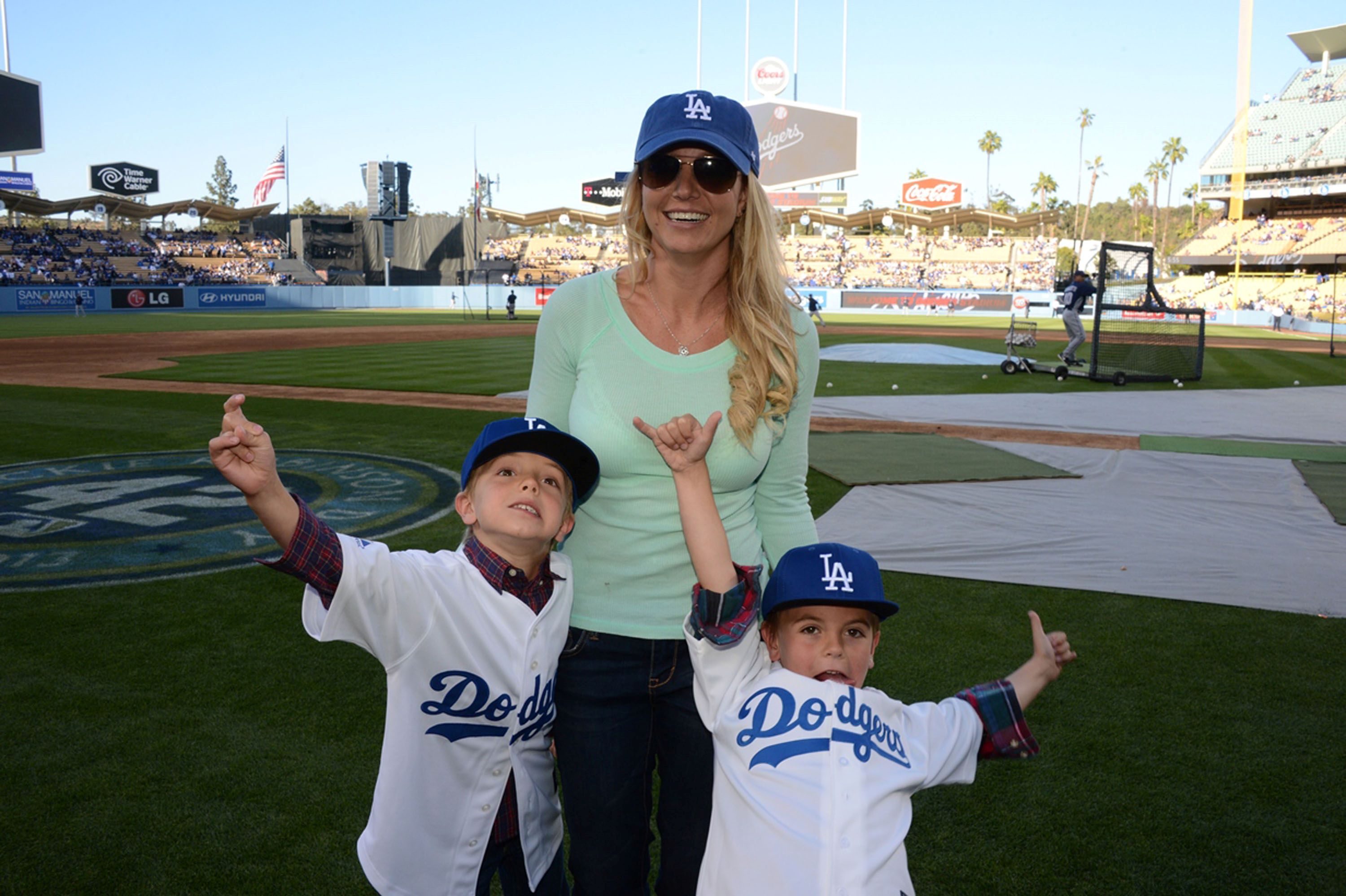 Britney Spears and sons at baseball game.