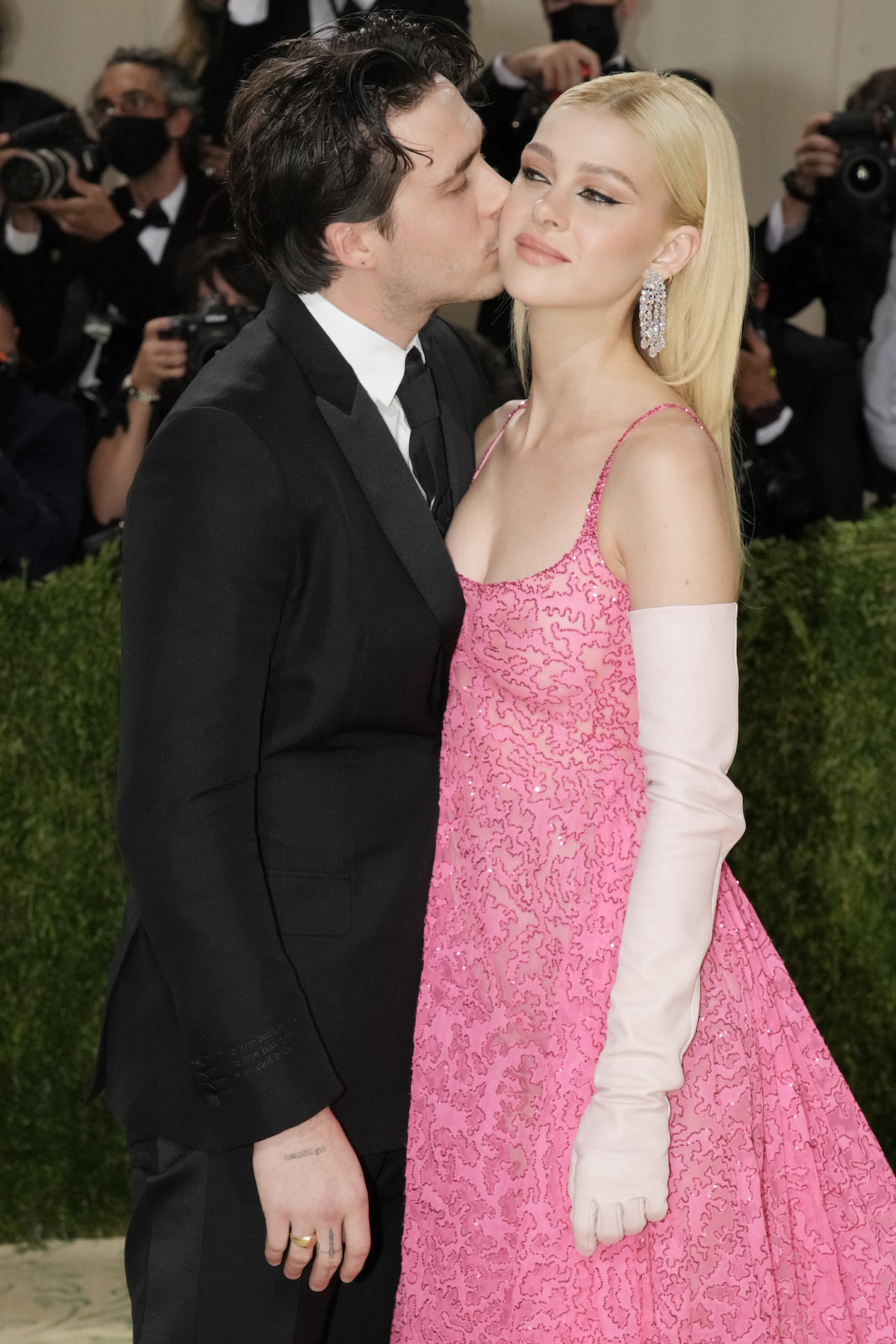 Brooklyn Beckham kisses Nicola Peltz on the cheek at the 2021 Met Gala
