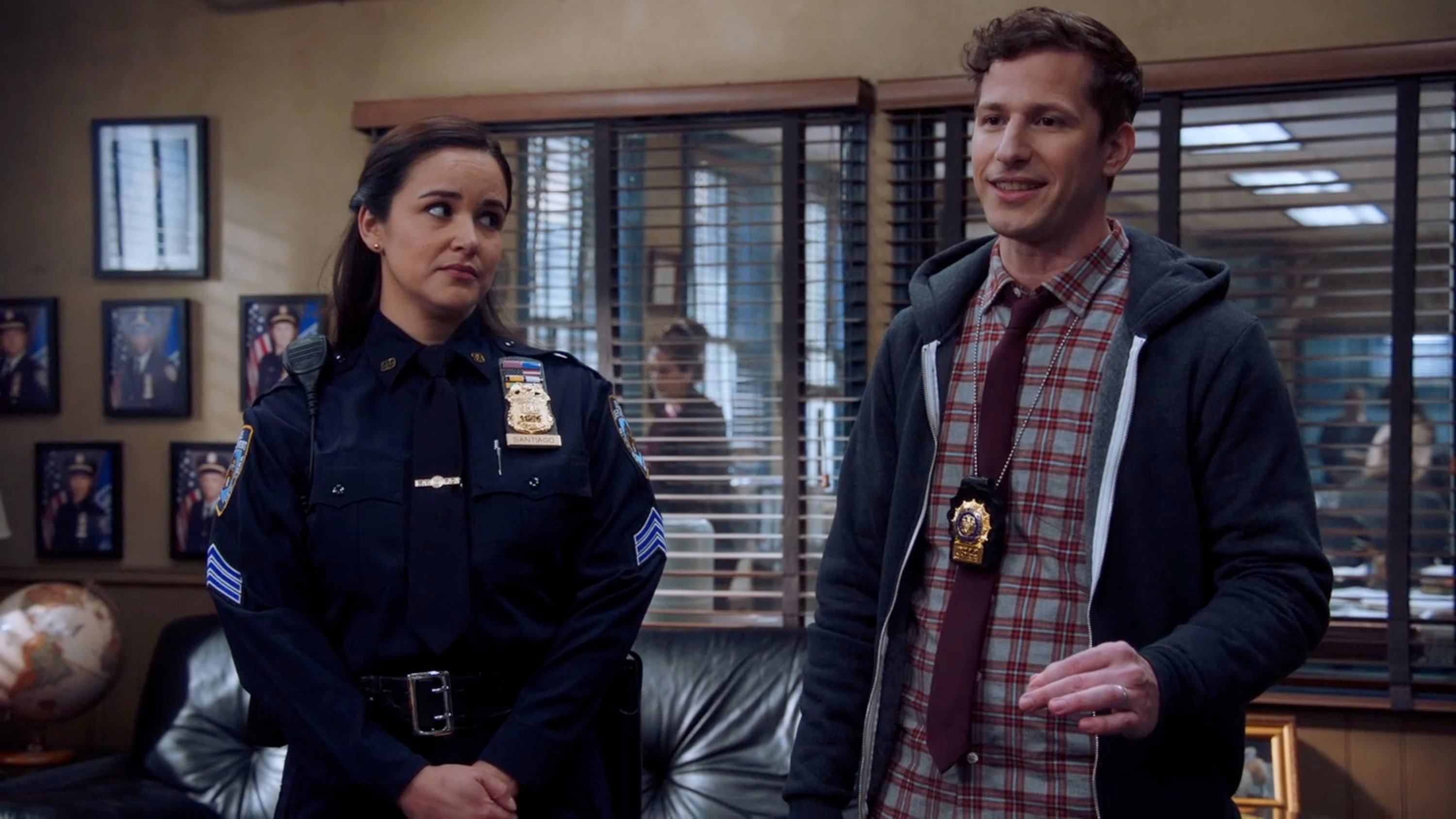 Amy Santiago and Jake Peralta stand together in 'Brooklyn Nine-Nine'