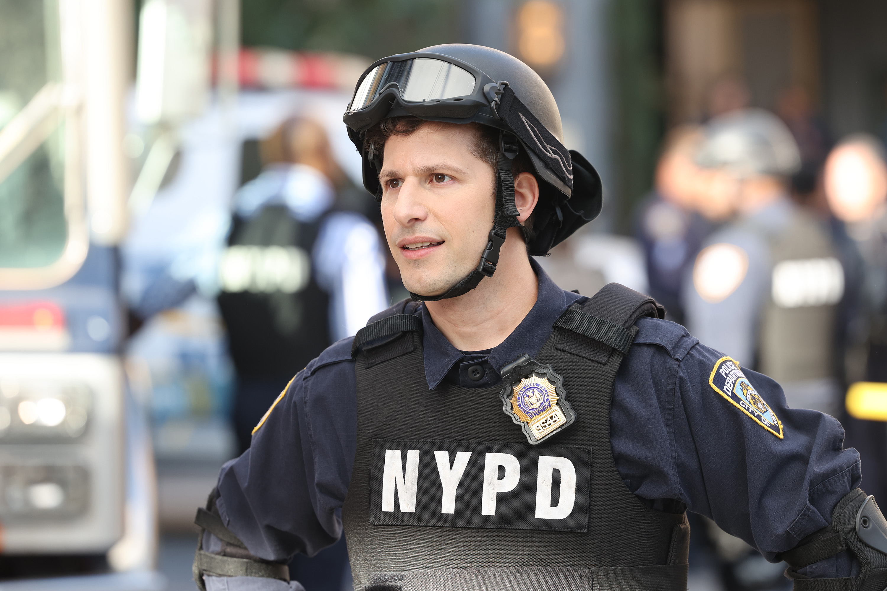 Jake Peralta wears a helmet and NYPD vest in season 8 of 'Brooklyn Nine-Nine'