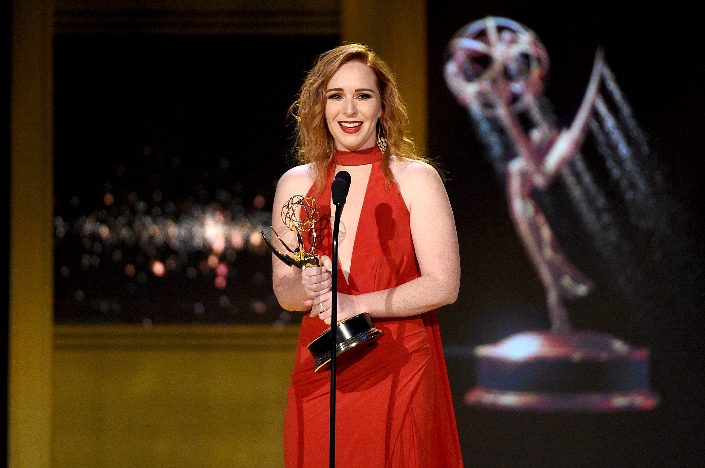 'The Young and the Restless' actor Camryn Grimes in a red dress as she accepts the Supporting Actress award at the 2018 Daytime Emmy Awards.