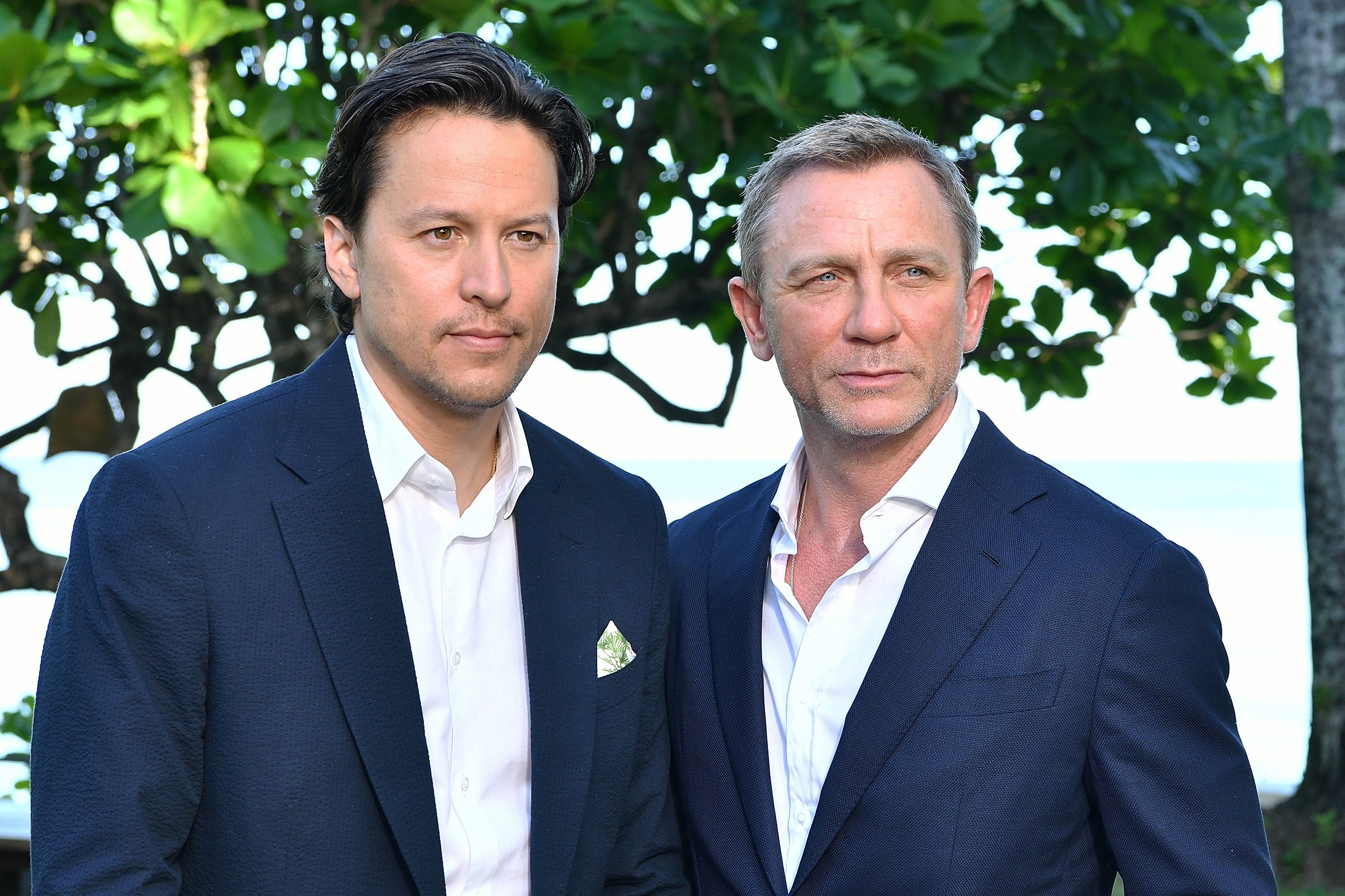 Cary Fukunaga and Daniel Craig, both in blue jackets and white shirts, at the 'Bond 25' film launch in 2019.