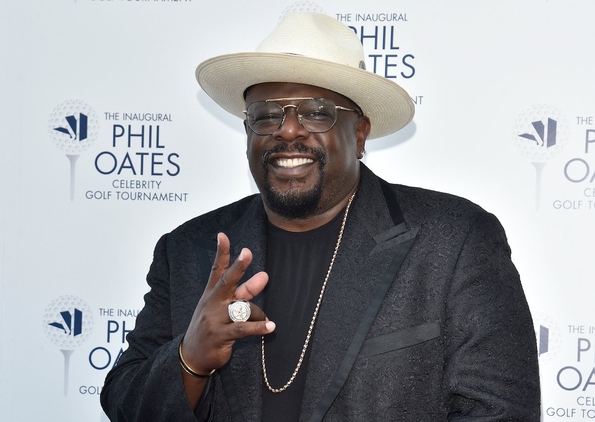 Emmy host Cedric the Entertainer smiles for the camera in a cowboy hat