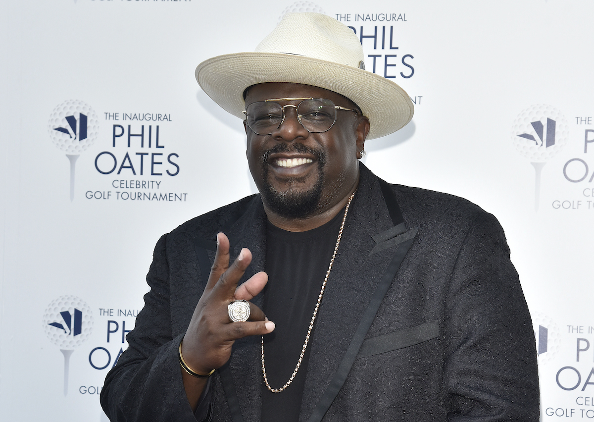 Emmy host Cedric the Entertainer smiles for the camera in a cowboy hat