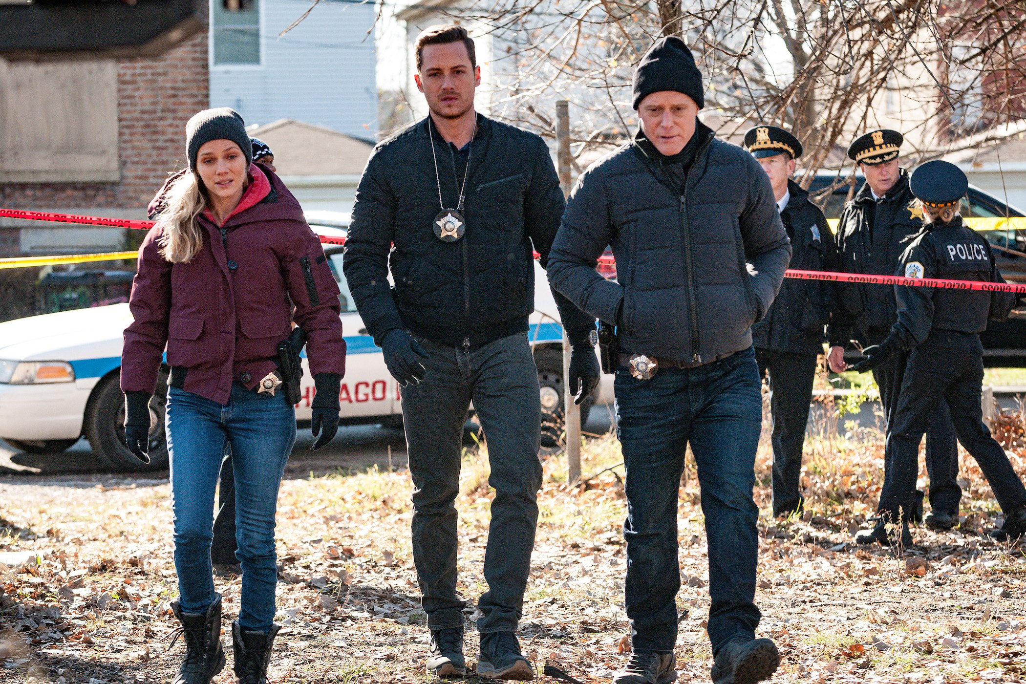 Hailey Upton, Jay Halstead, and Hank Voight from 'Chicago P.D.' Season 9 walking together outside