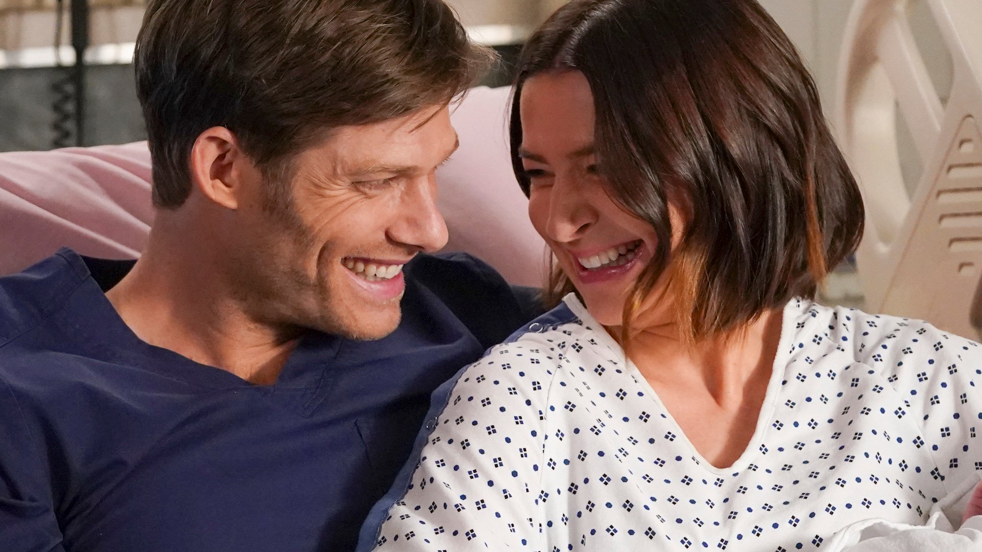 Chris Carmack as Link and Caterina Scorsone as Amelia holding their baby together in ‘Grey’s Anatomy’