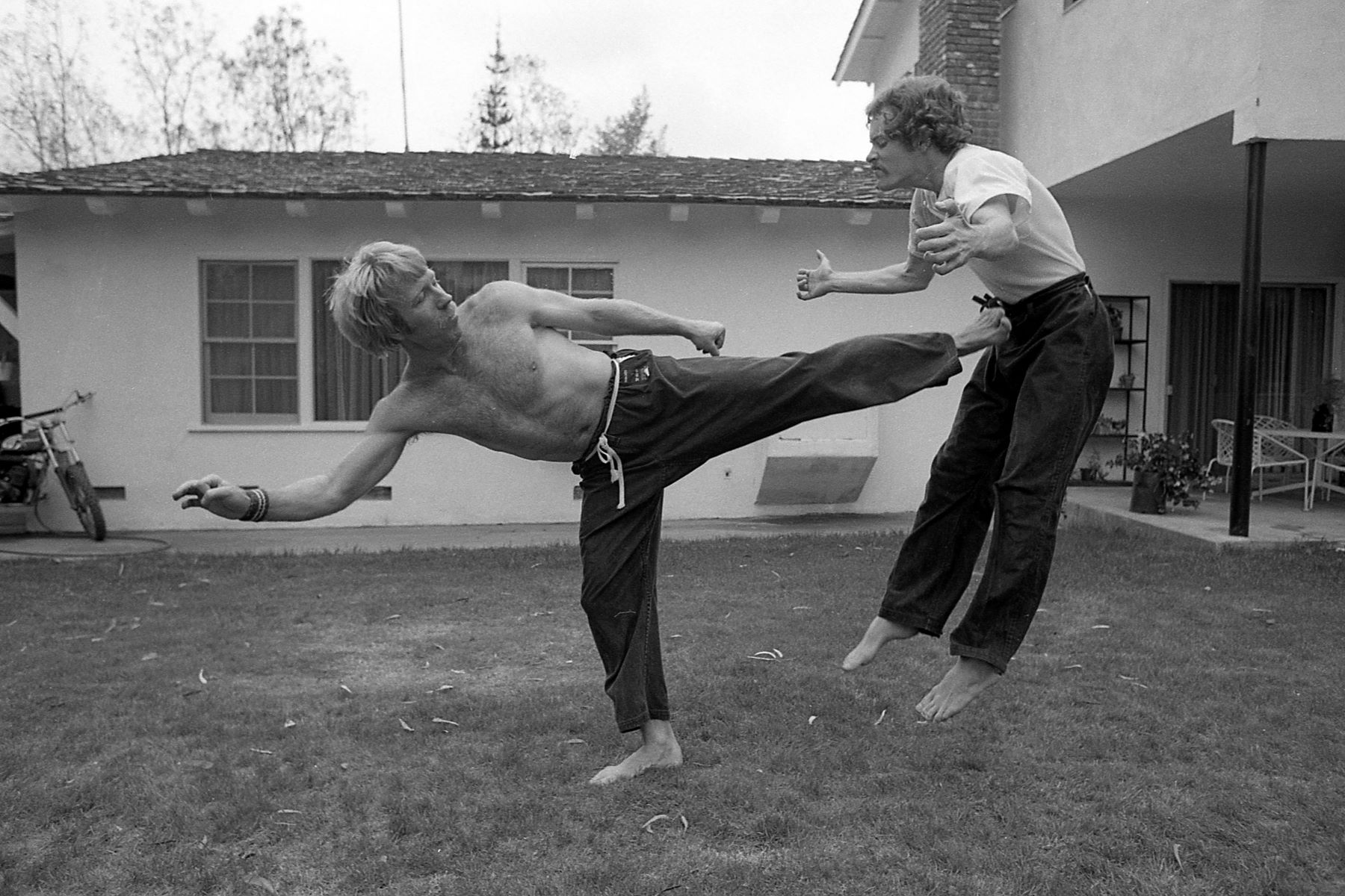 Chuck Norris practicing martial arts with his trainer in Los Angeles, California