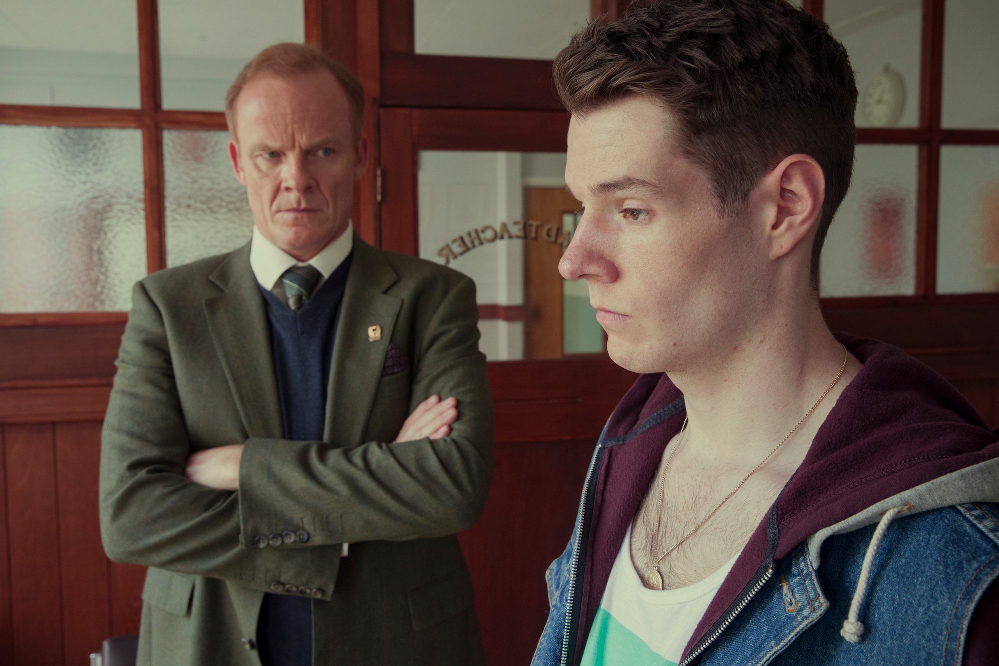 Connor Swindells, and Alistair Petrie talking to each other in 'Sex Education' Season 1.