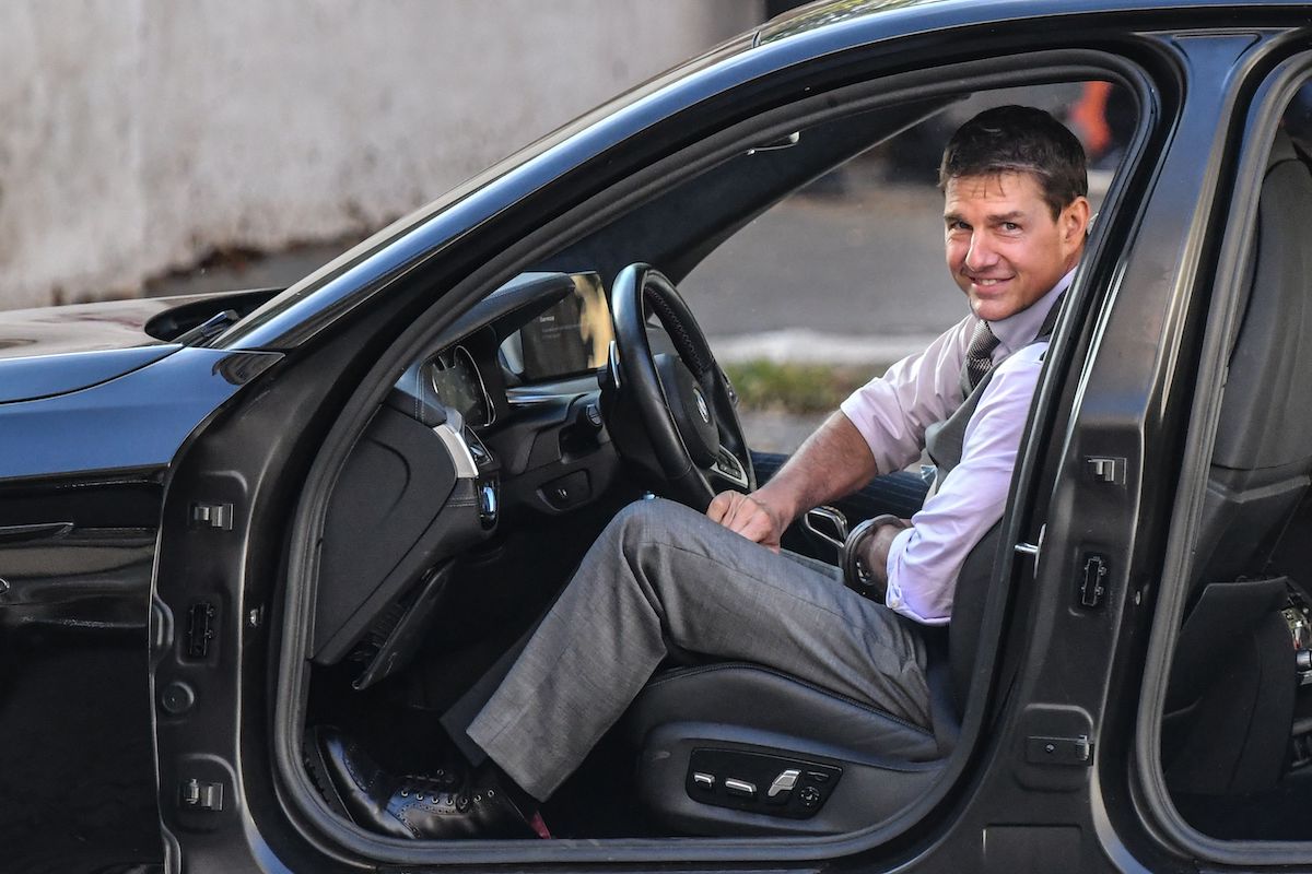 Tom Cruise sitting in a stunt car