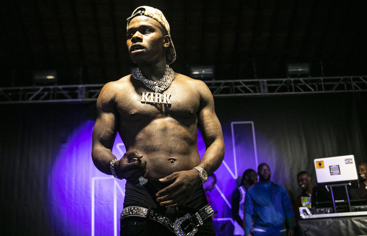 DaBaby appears shirtless with a diamond chain performs on October 09, 2019 in Charlotte, North Carolina. 