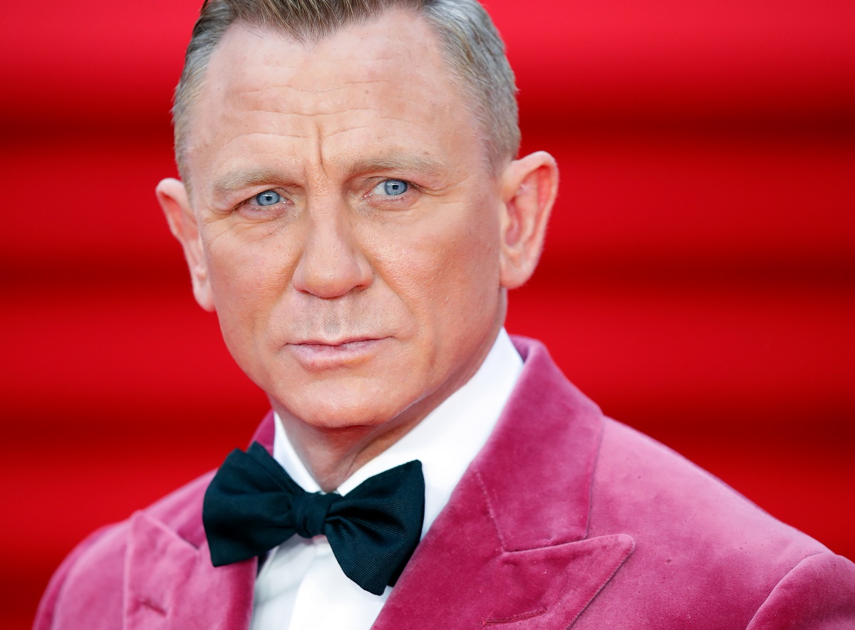 Daniel Craig posing with pink blazer
