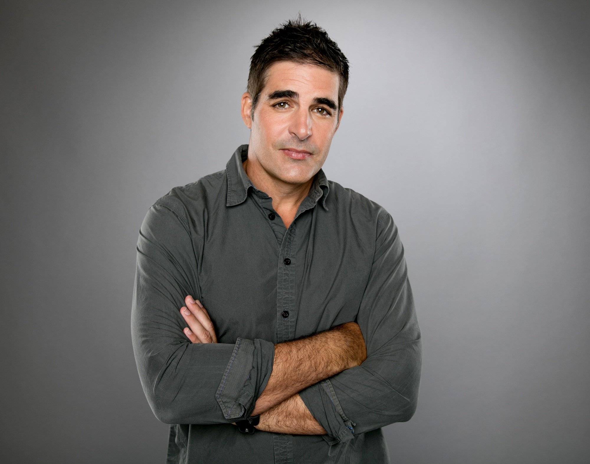 Days of Our Lives speculation focuses on Rafe, pictured here in a long grey shirt against a grey background