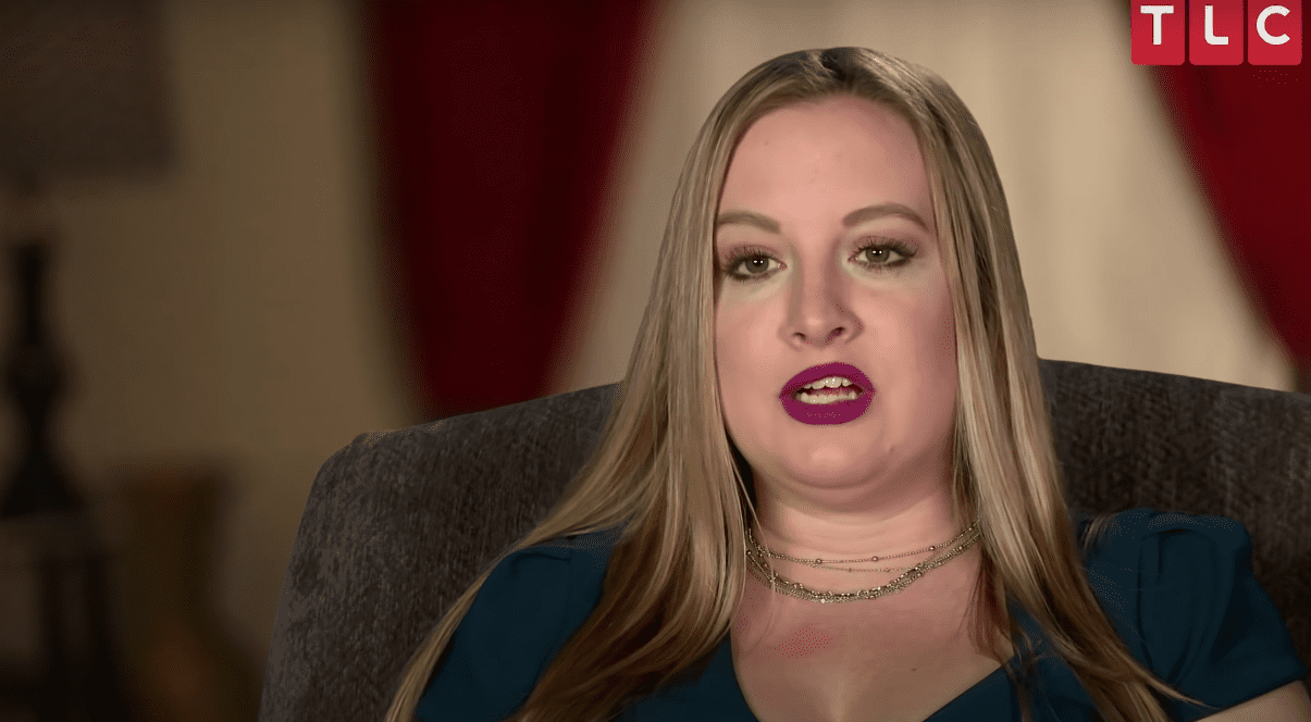 Elizabeth 'Libby' Potthast sits in a chair on '90 Day Fiancé'
