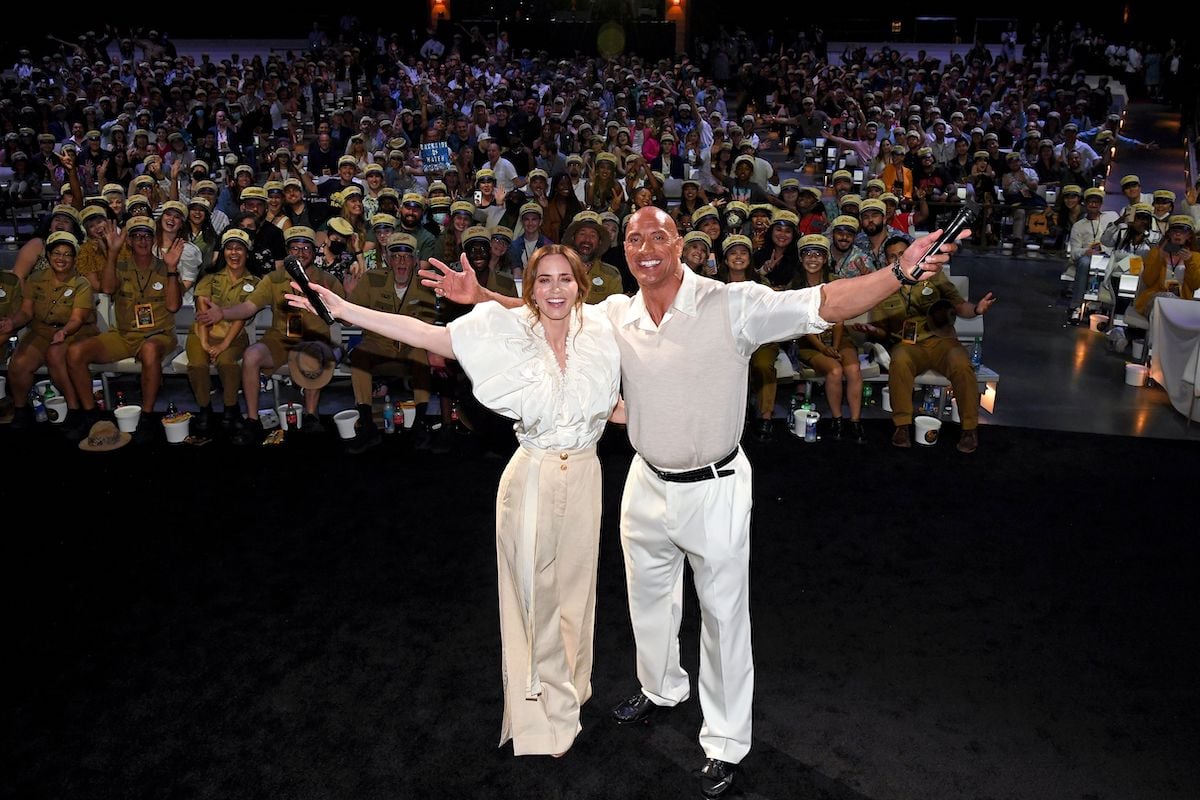 Emily Blunt and Dwayne Johnson raise their arms