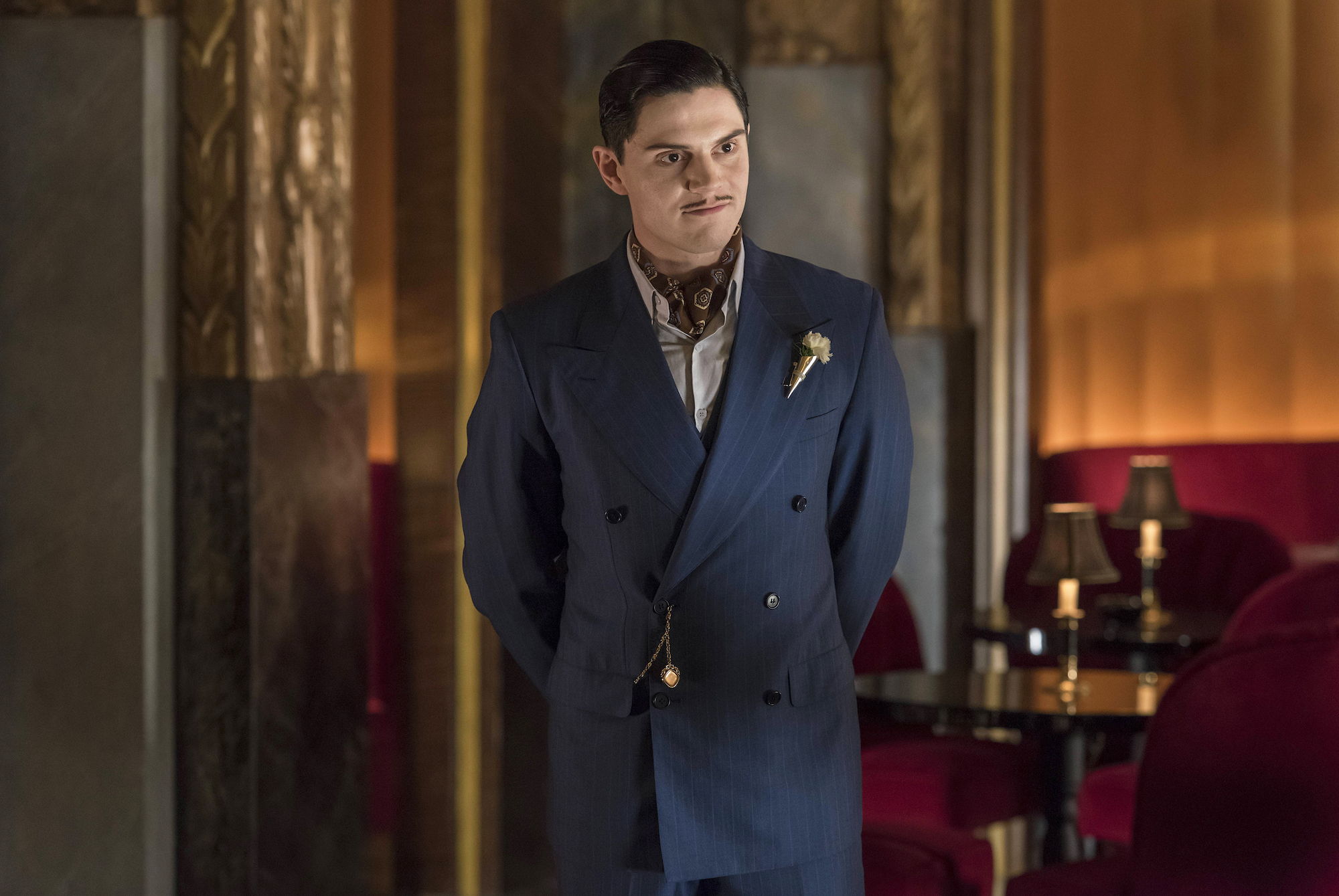 Evan Peters plays James Patrick March and he's standing in Hotel Cortez in 'American Horror Story: Hotel.'