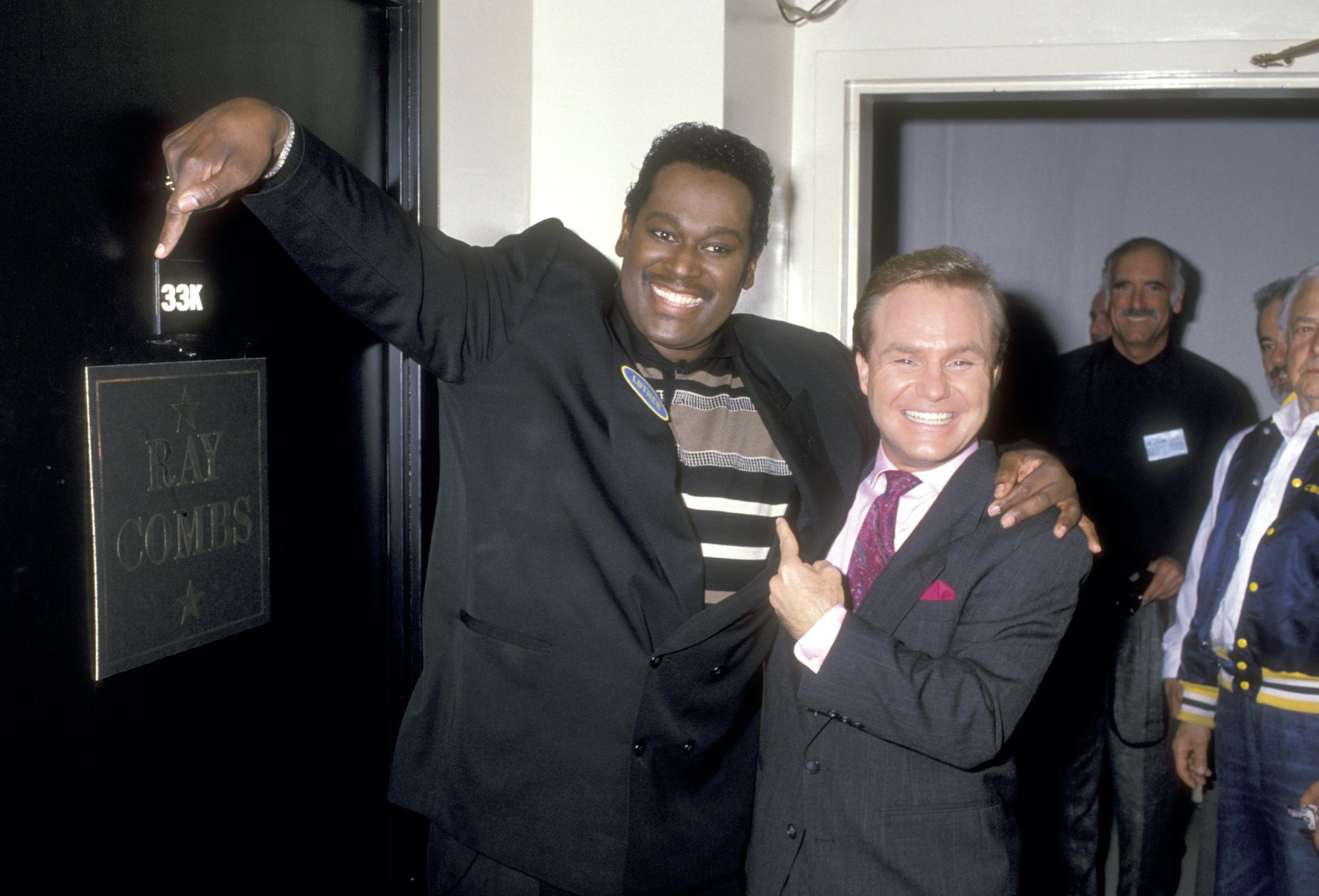 Singer Luther Vandross and game show host Ray Combs backstage at the Taping of 'Family Feud'