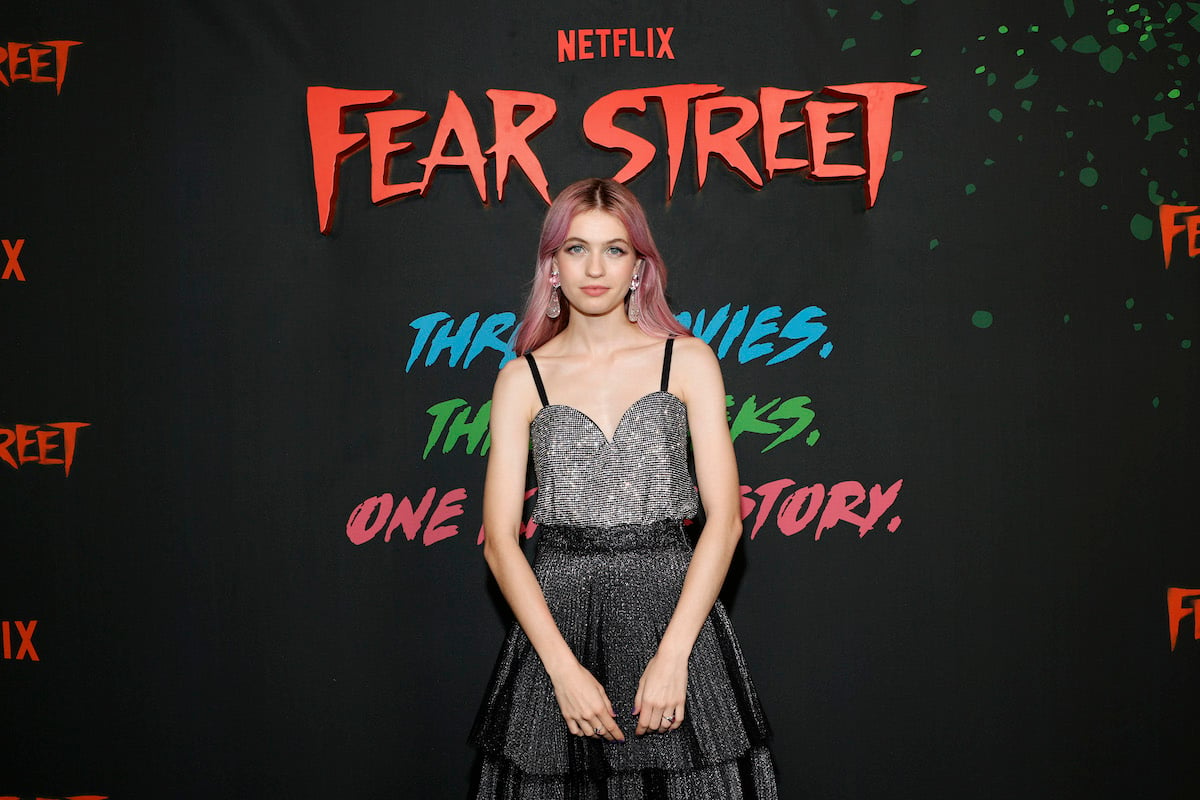 Olivia Scott Welch wearing a silver and black dress at a 'Fear Street' event.
