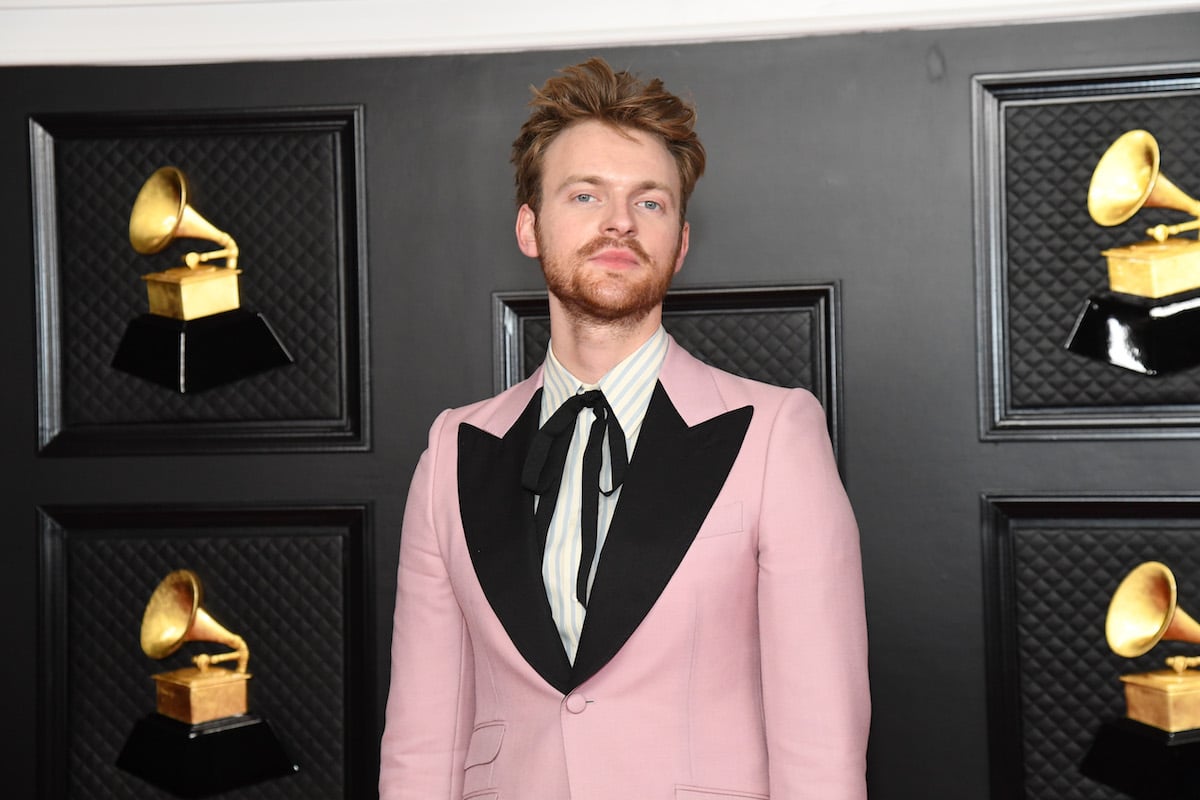 Finneas O'Connell wearing a pale pink tuxedo.