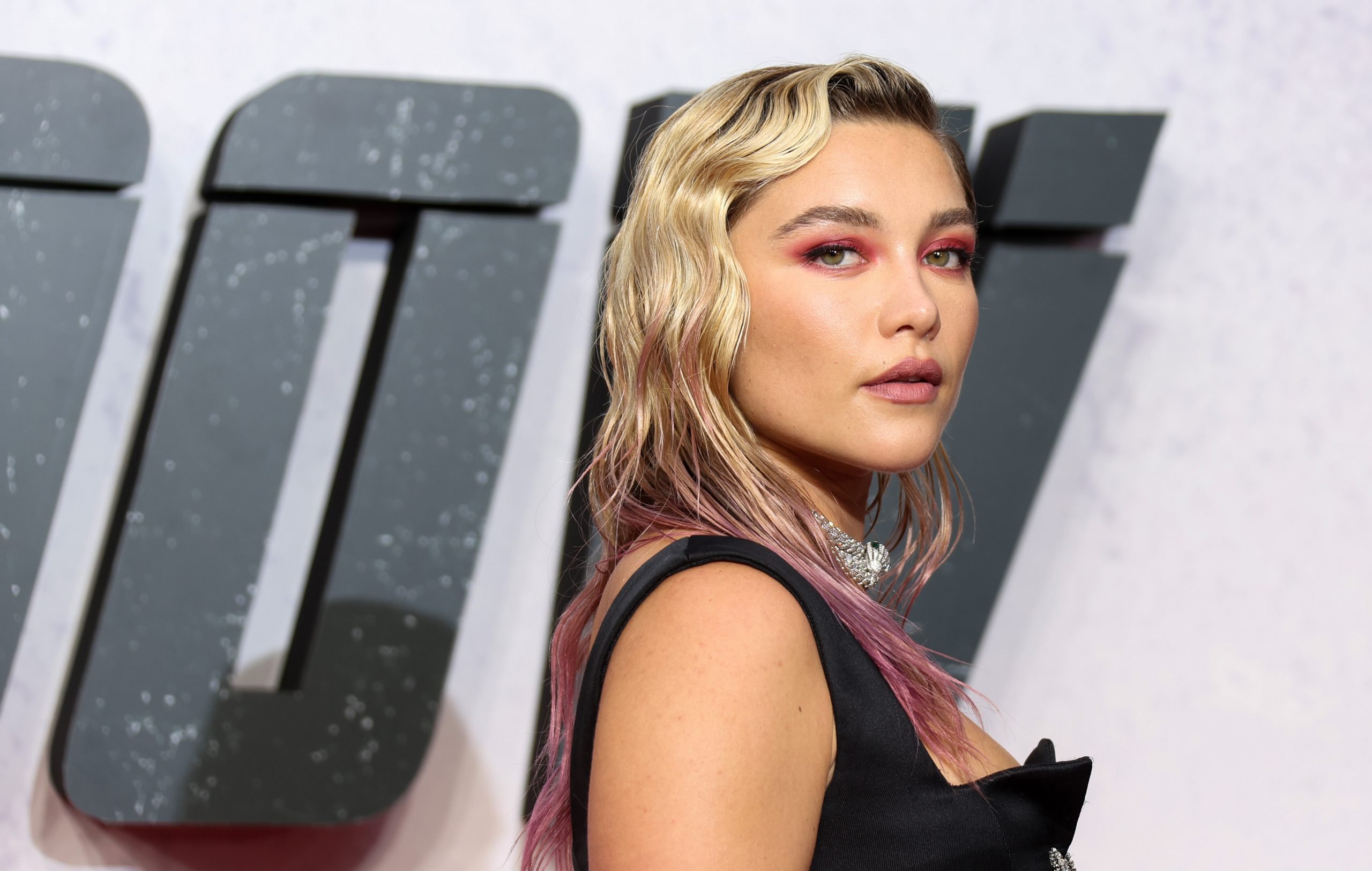 Florence Pugh stands in front of a 'Black Widow' poster at the movie's UK premiere. Pugh played Yelena Belova in 'Black Widow,' marking a huge new phase of her career. And she feared how making the move to the MCU would be received by fans.