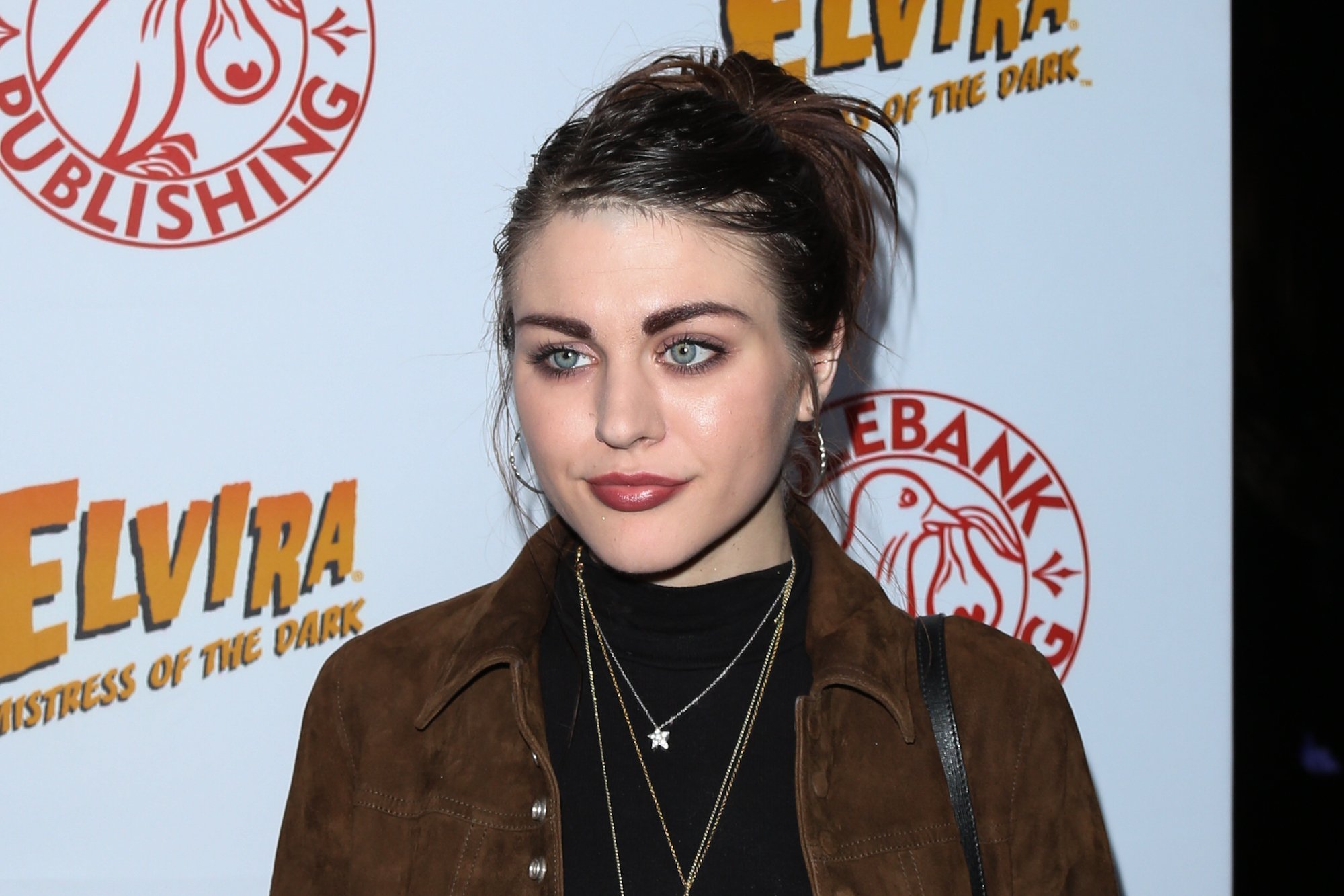 Frances Bean Cobain in front of a white background