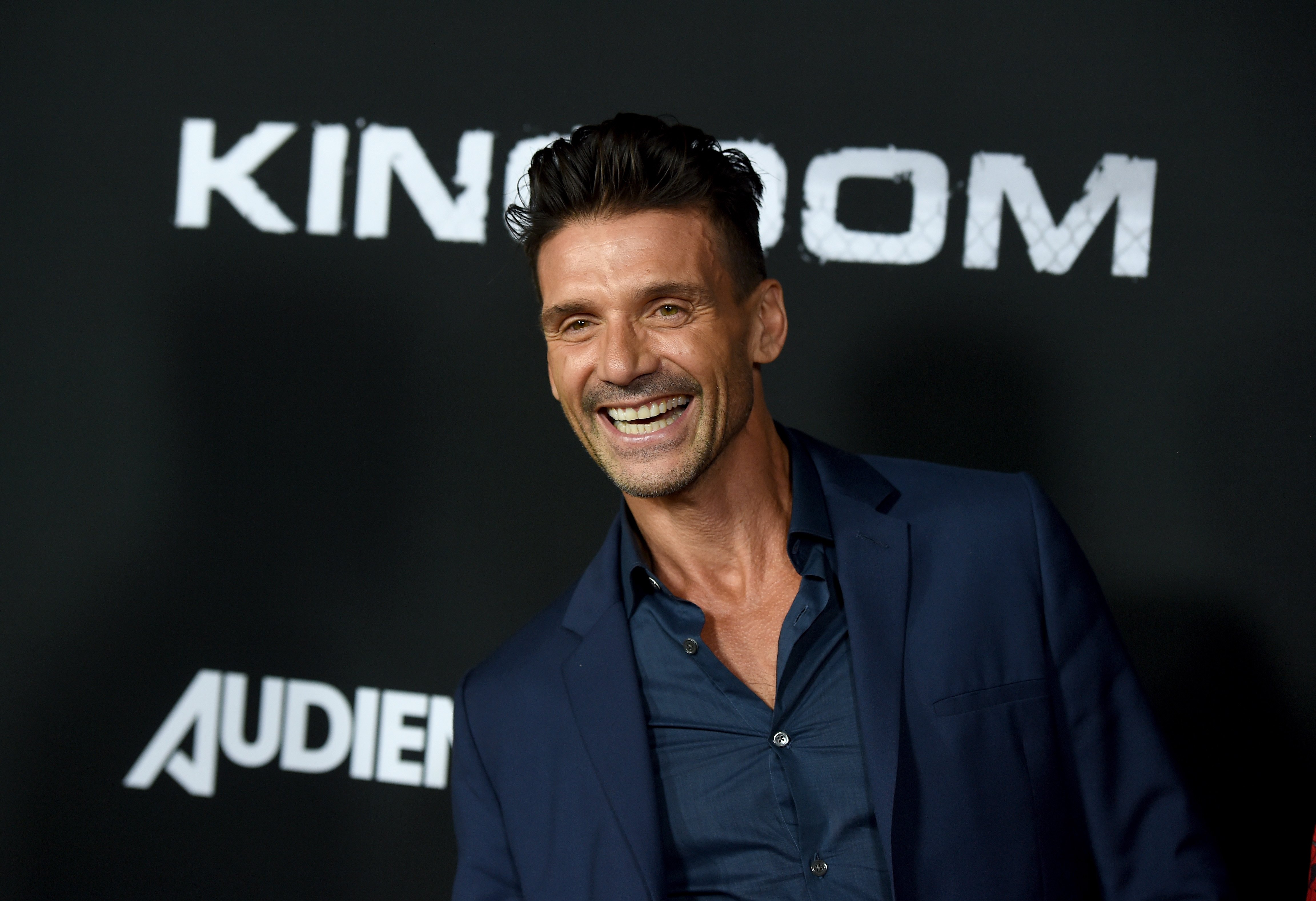 Frank Grillo, star of Copshop 2021, smiles wide at a premiere