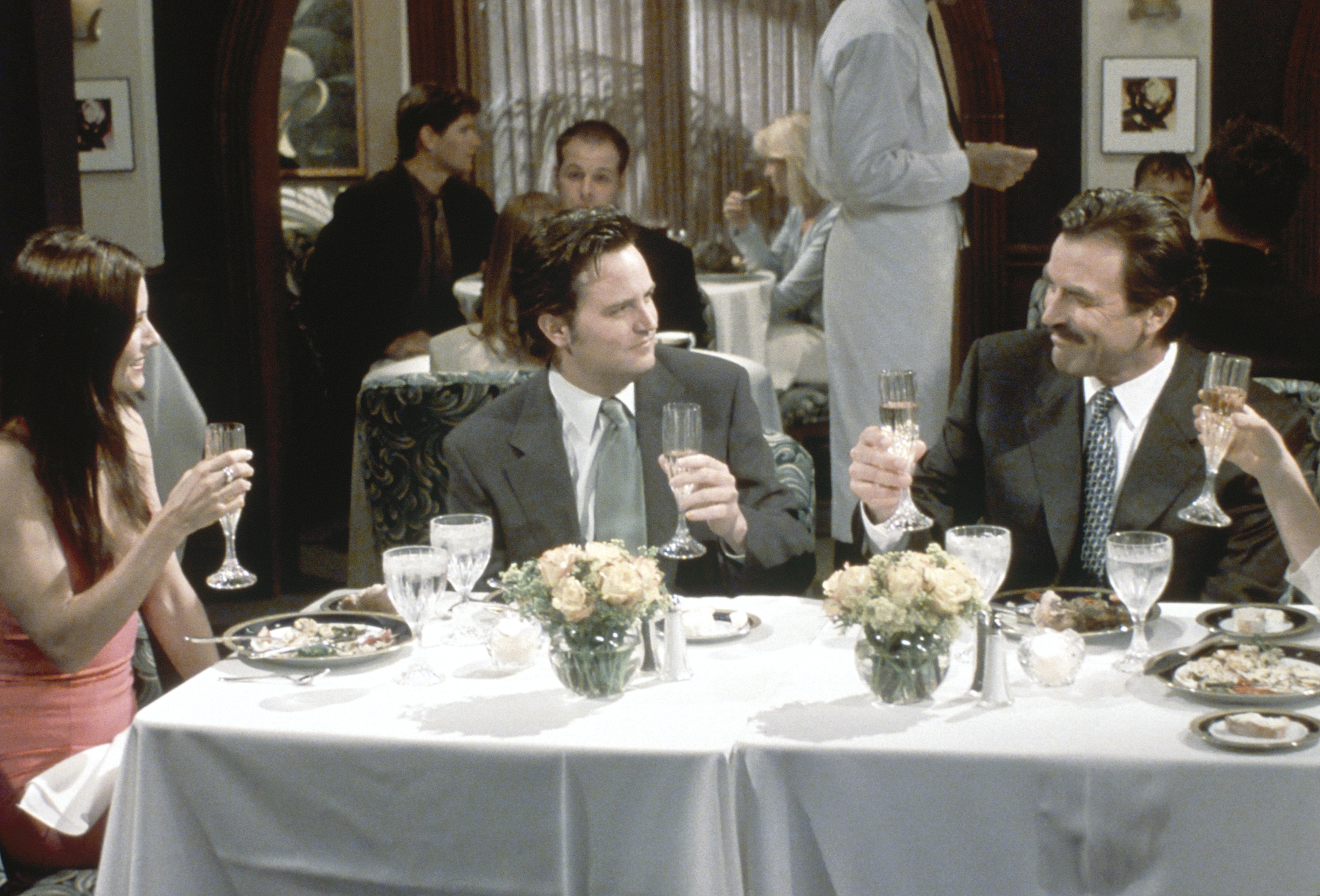 Monica Geller, Chandler Bing and Richard Burke sit down for dinner together in season 9 of 'Friends'