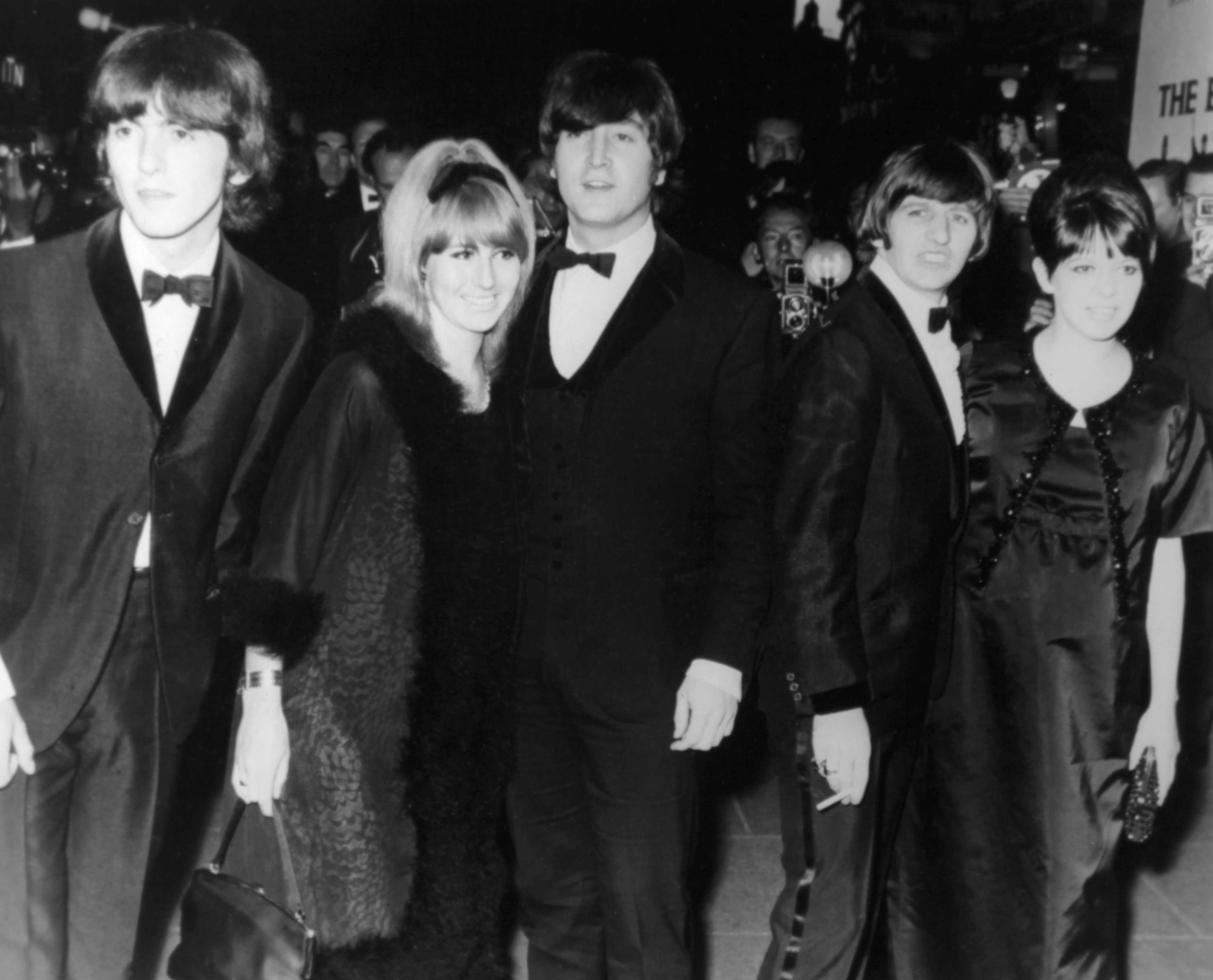George Harrison, John Lennon with his wife Cynthia Powell, Ringo Starr and his wife Maureen Cox arrive at the premiere of their movie 'Help' directed by Richard Lester at the London Pavilion on July 29, 1965 in London, United Kingdom.