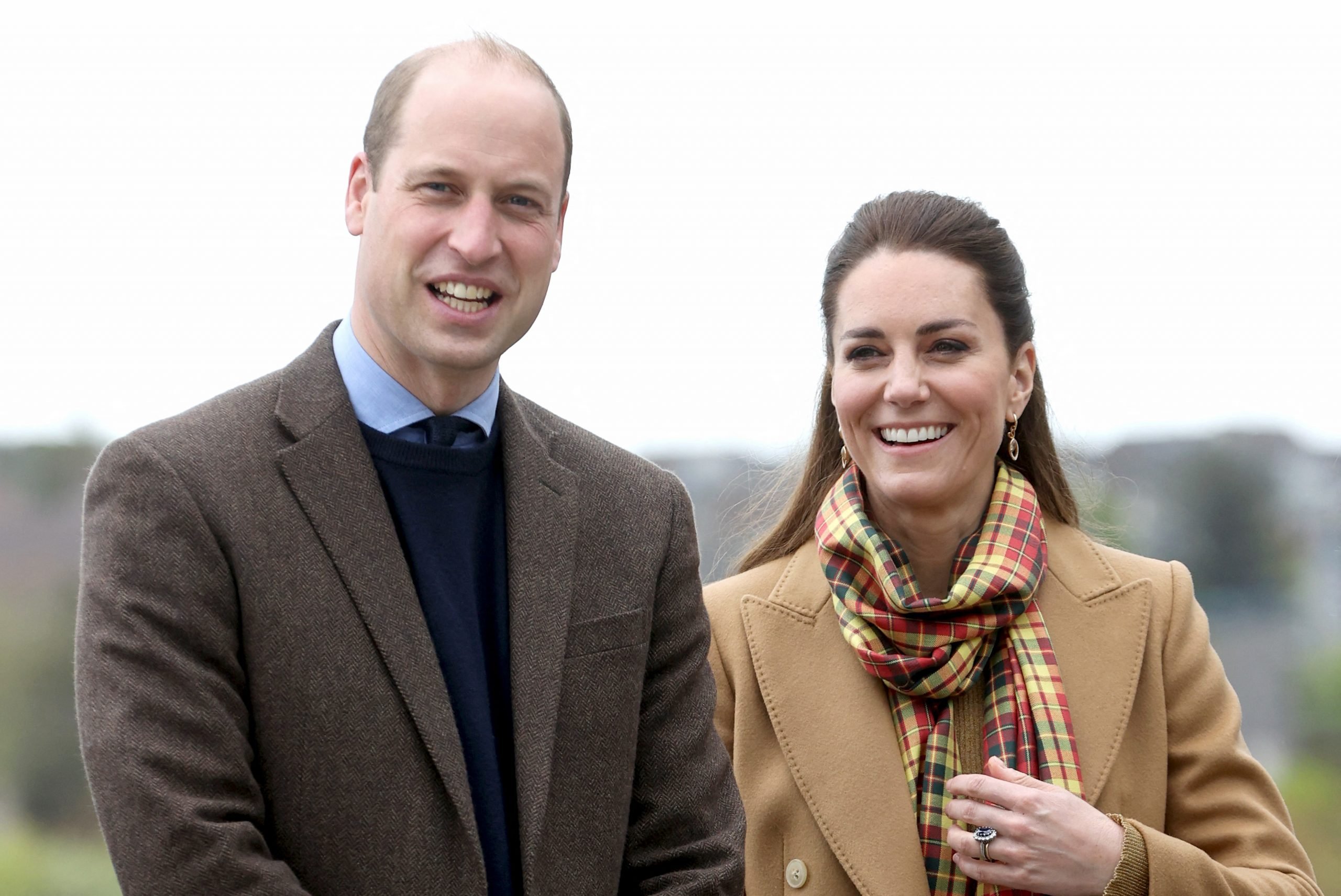 Kate Middleton and Prince William laugh at a photocall