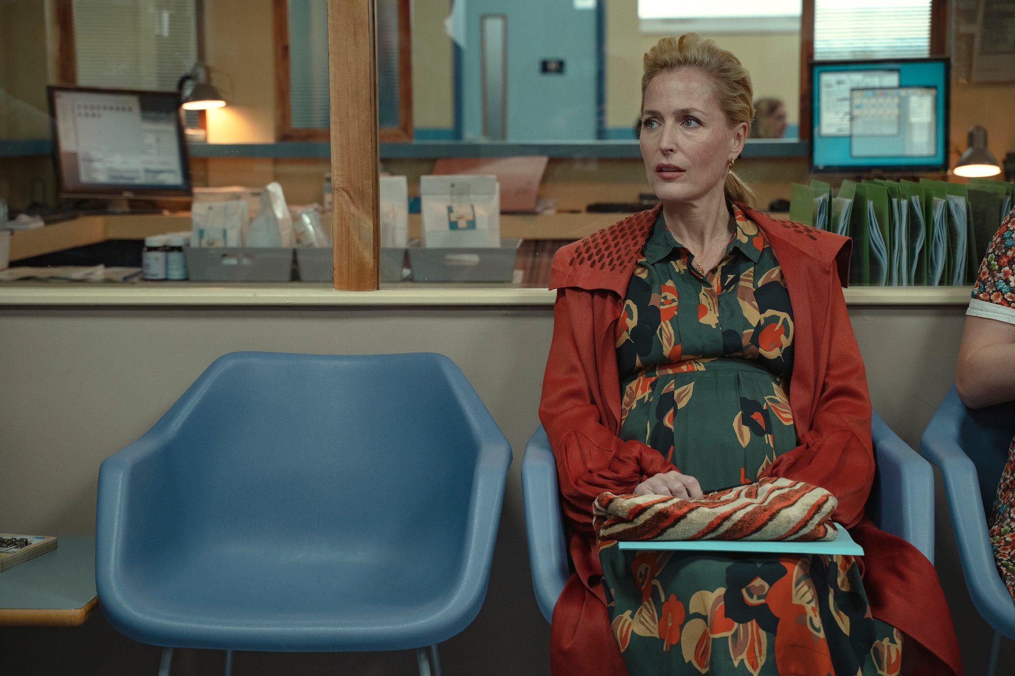 Gillian Anderson sitting in a chair in 'Sex Education' Season 3