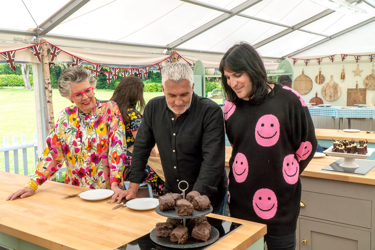 Paul Hollywood, Prue Leith and Noah Fielding standing over some chocolate in 'The Great British Baking Show'