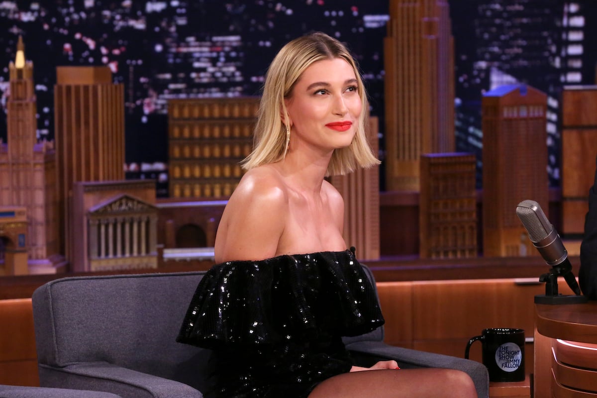 Hailey Bieber with blonde hair wearing a black dress on "The Tonight Show."