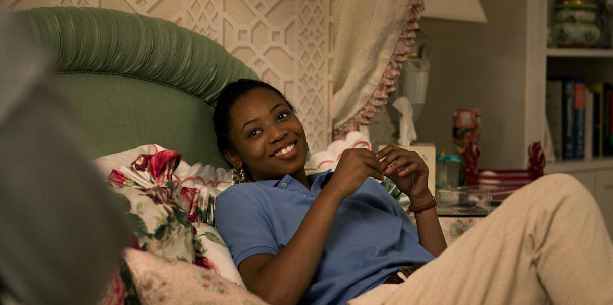 Hailey Kilgrove smiles on the bed as Jukebox in 'Power Book III: Raising Kanan'
