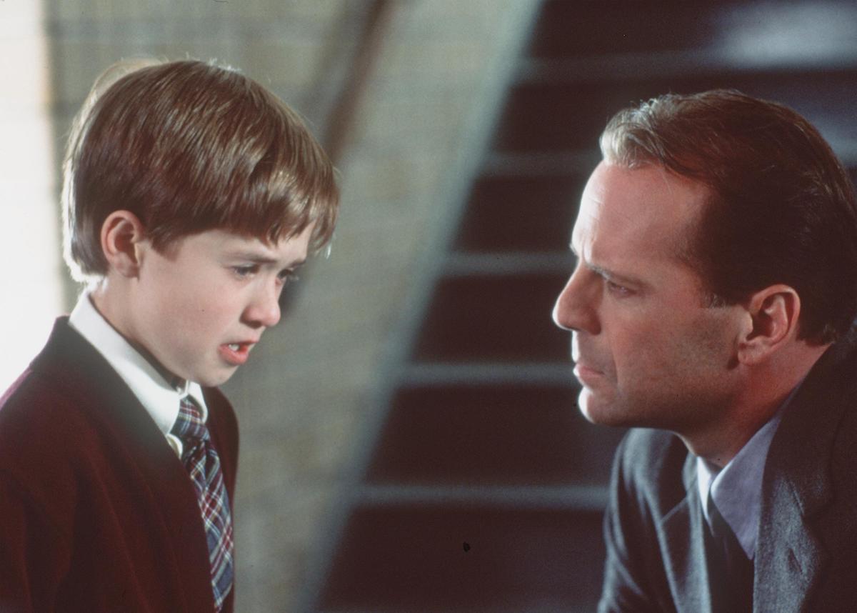 Bruce Willis looks at a tearful Haley Joel Osment in a scene from 'The Sixth Sense'