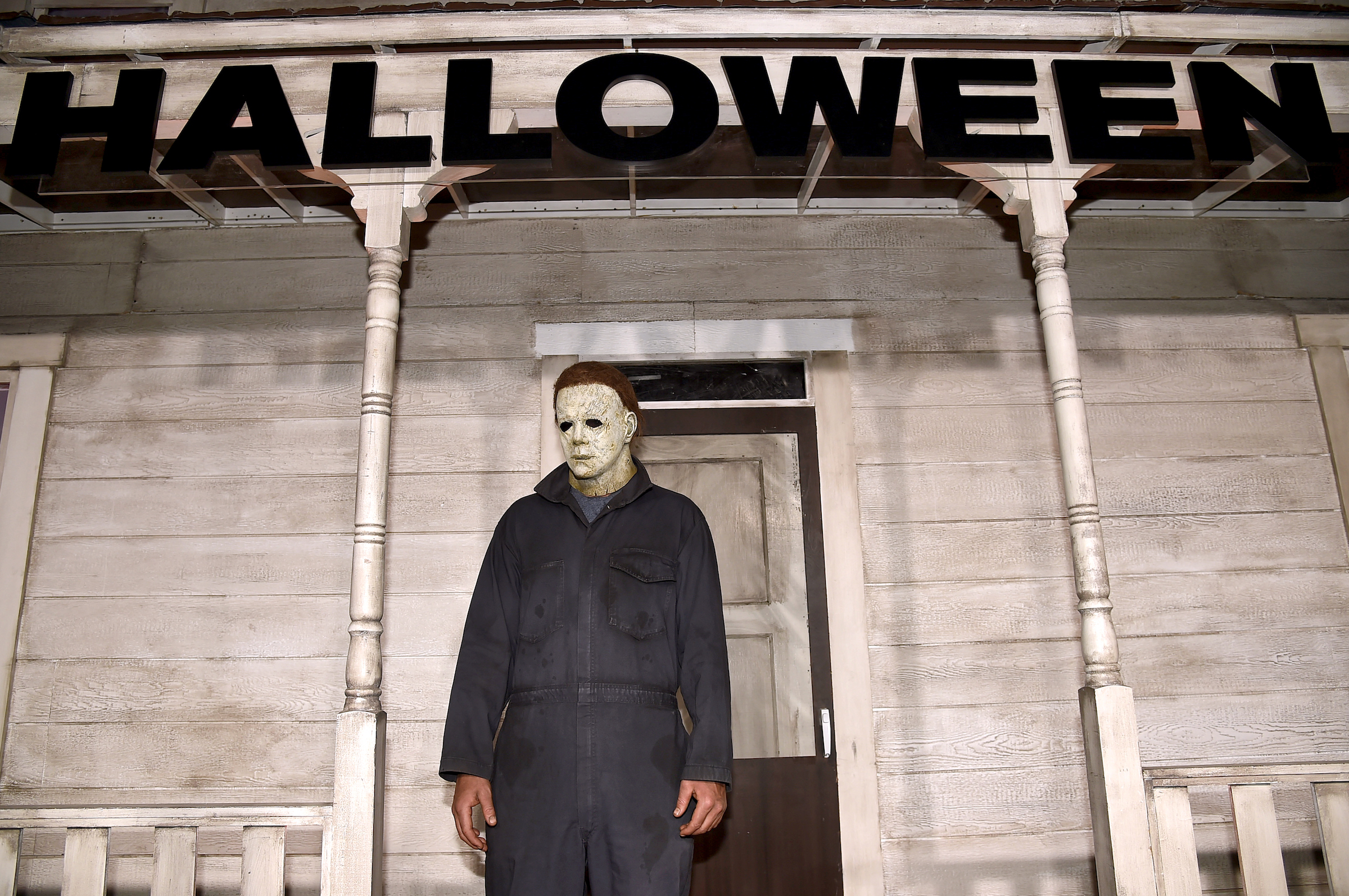 An actor dressed as Michael Myers scares guests at Universal's Halloween movie premiere in 2018