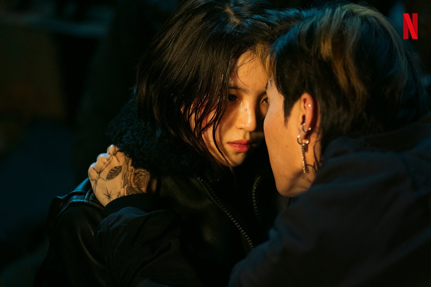 Actor Han So-Hee as Ji-Woo in 'My Name' in black jacket staring at another character