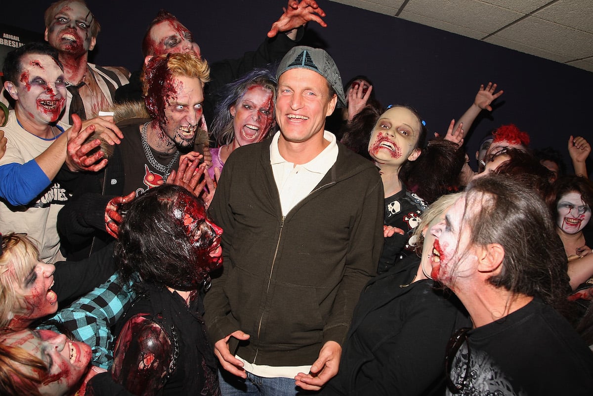 Woody Harrelson with a group of zombies