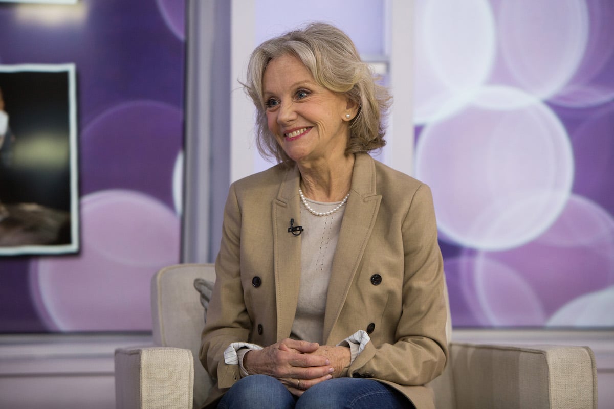 Hayley Mills with a purple background.