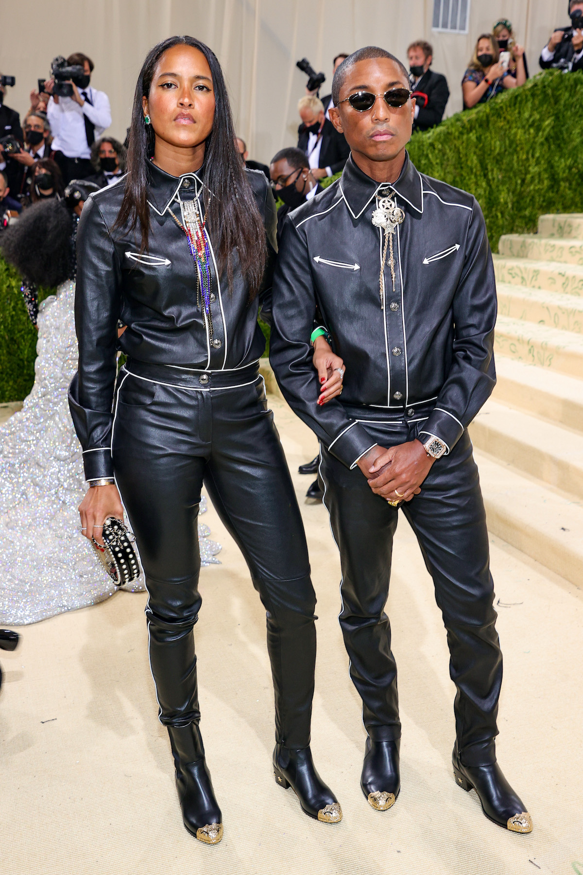 Helen Lasichanh and Pharrell Williams poses for photos wearing black outfits at the 2021 Met Gala