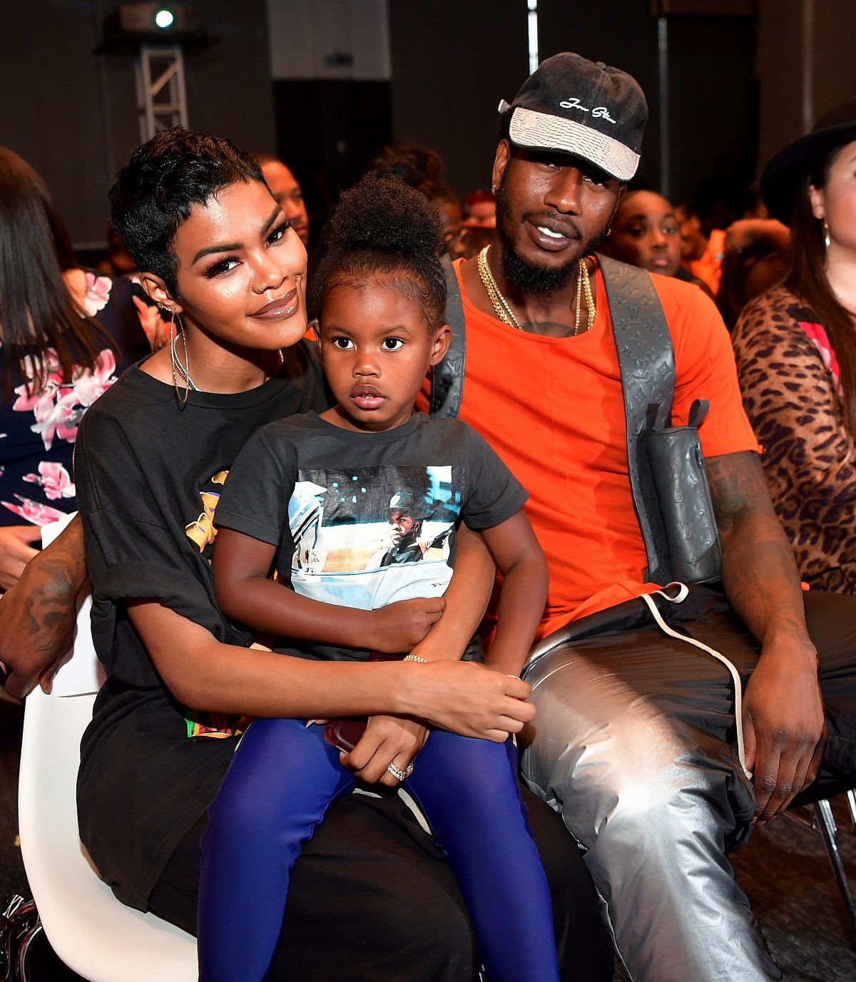 Iman Shumpert and Teyana Taylor holding their daughter, Iman Tayla Shumpert Jr., at 'You Be There' screening
