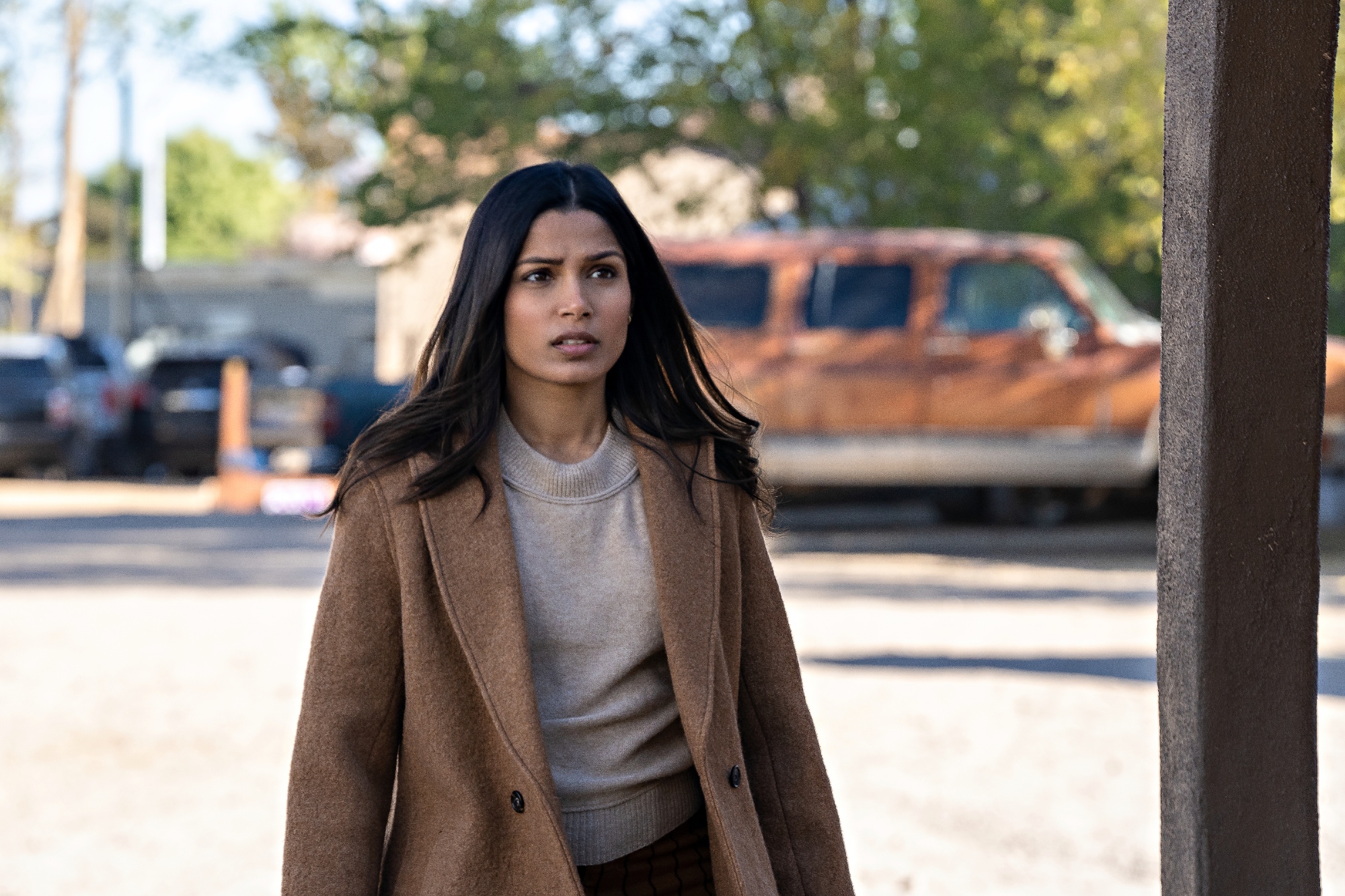 'Intrusion' star Freida Pinto as Meera in a brown coat investigating the mystery