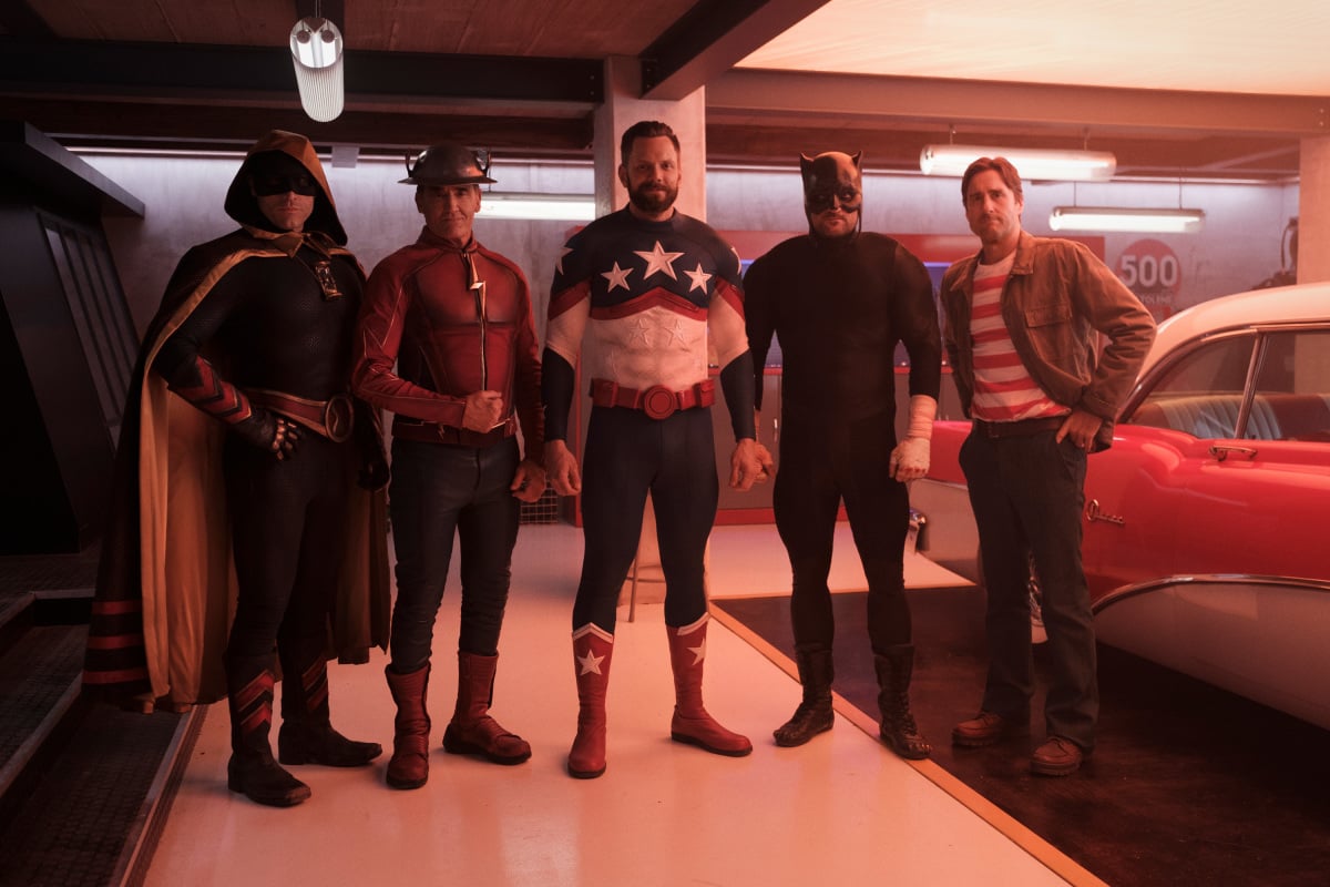 Lou Ferrigno Jr as Rex Tyler/Hourman, John Wesley Shipp as Jay Garrick/The Flash, Joel McHale as Sylvester Pemberton/Starman, Brian Stapf as Ted Grant/Wildcat, and Luke Wilson as Pat Dugan pose in their superhero costumes in 'Stargirl' Season 2 Episode 9.